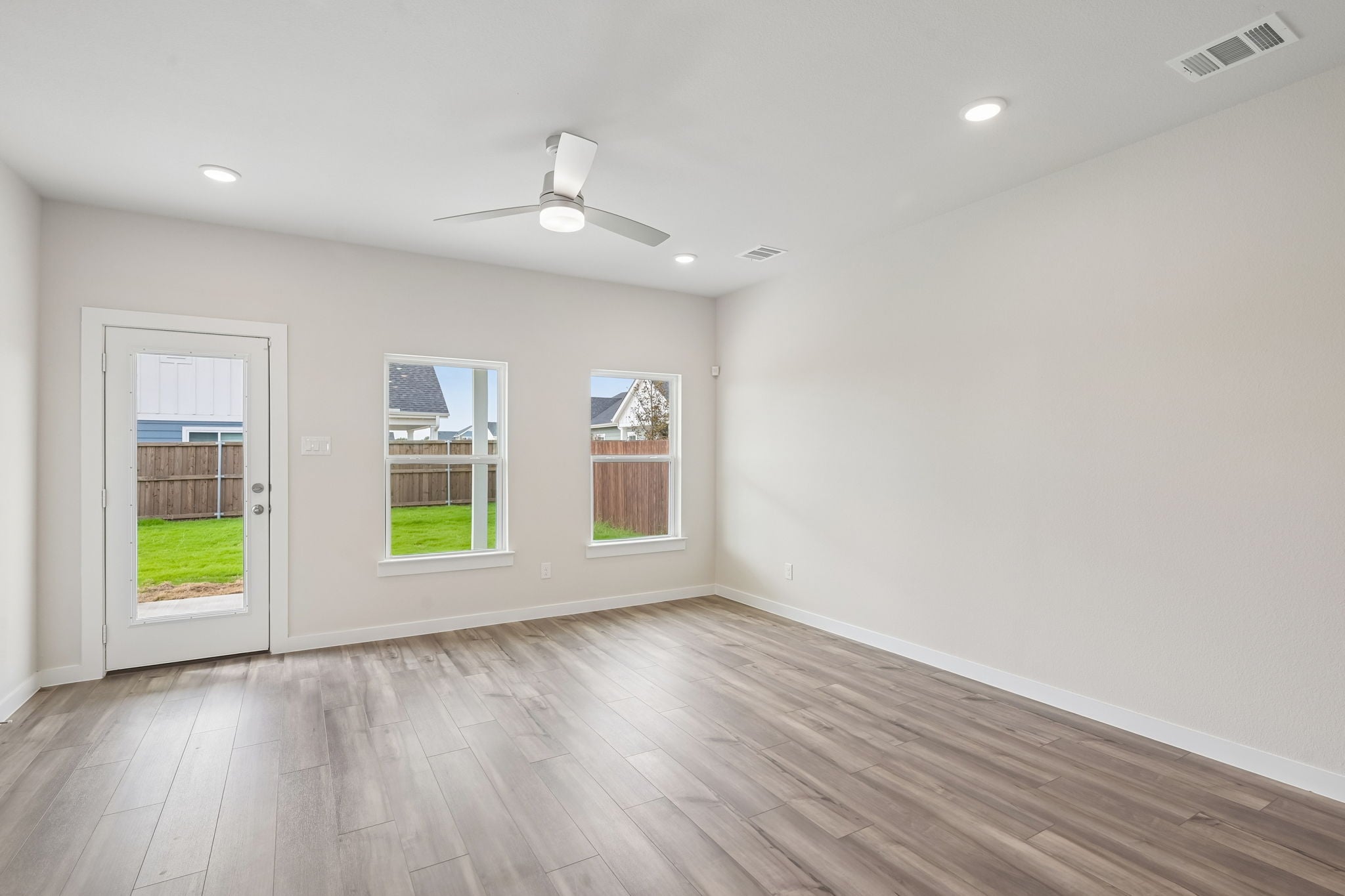 A room with a wood floor and a wood floor with a wood floor.