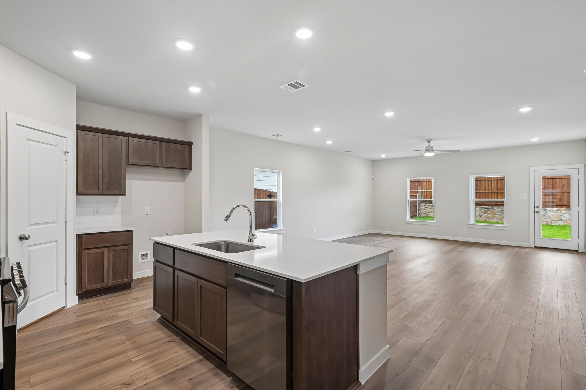 A kitchen with wooden cabinets.