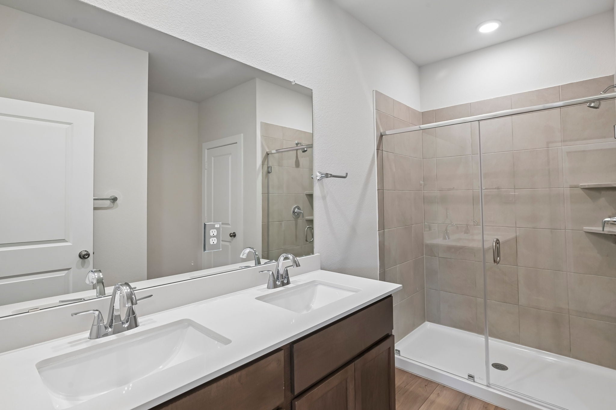 A bathroom with a glass shower.