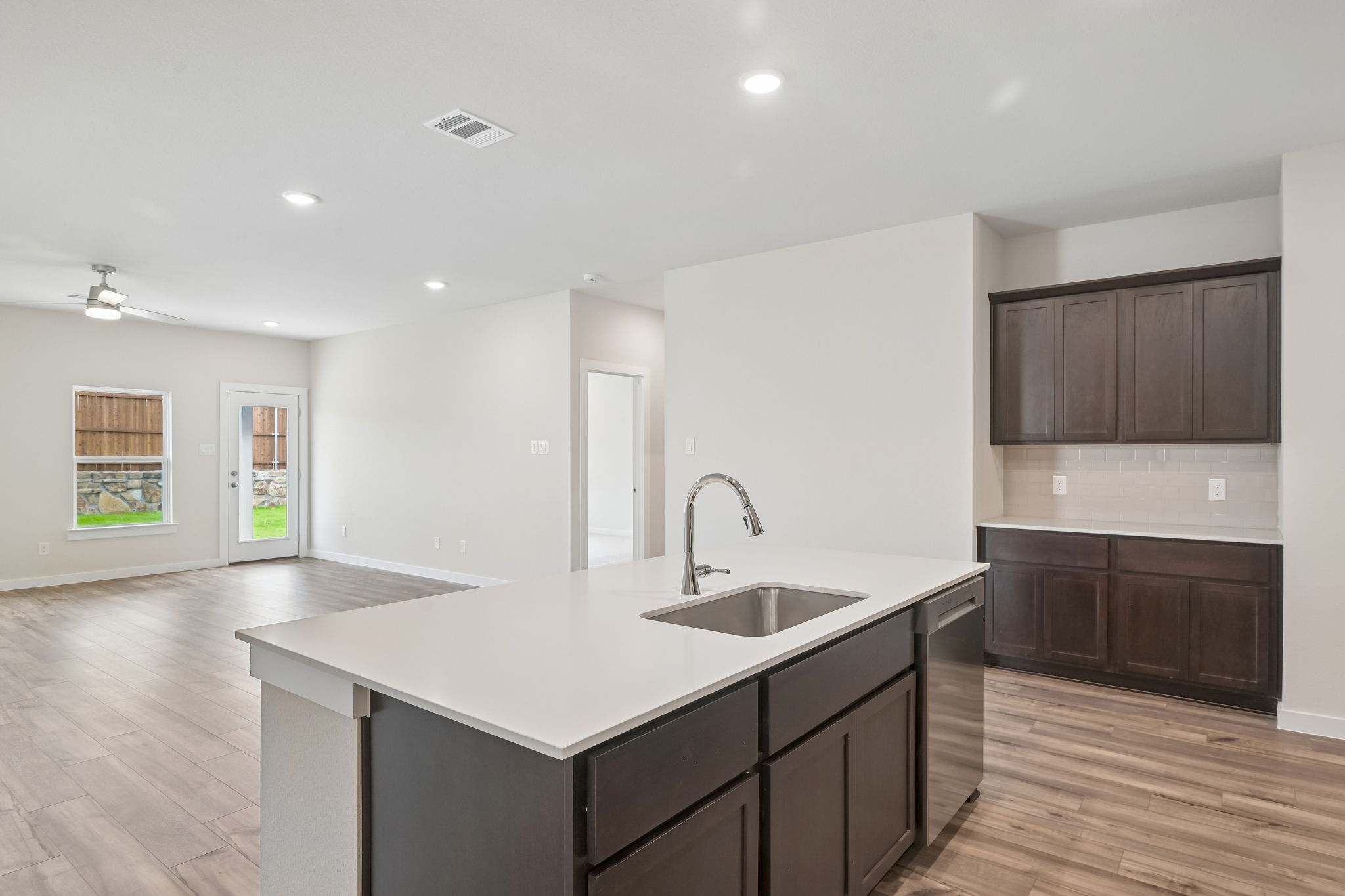 A kitchen with a marble countertop.