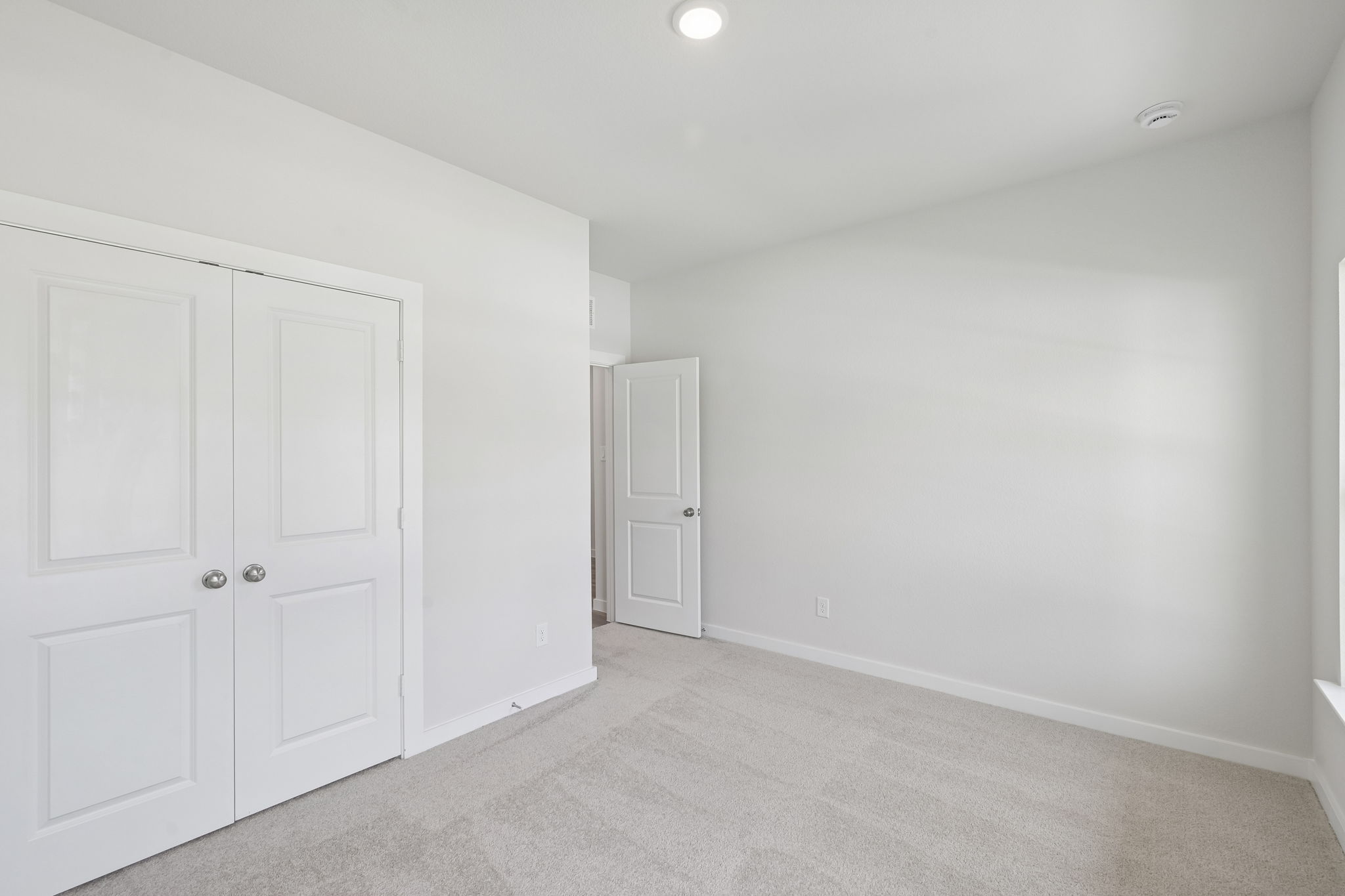 A room with white doors.