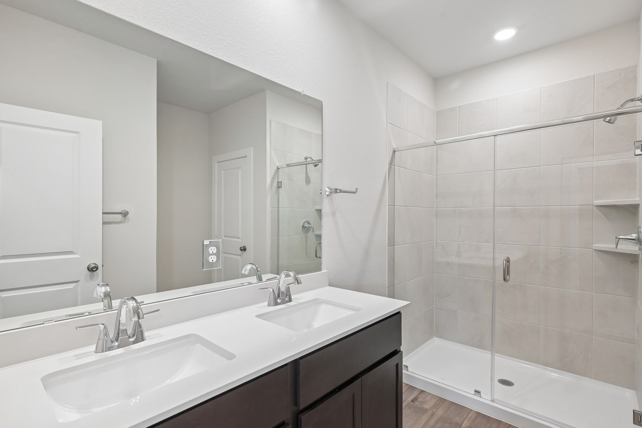 A bathroom with a glass shower.