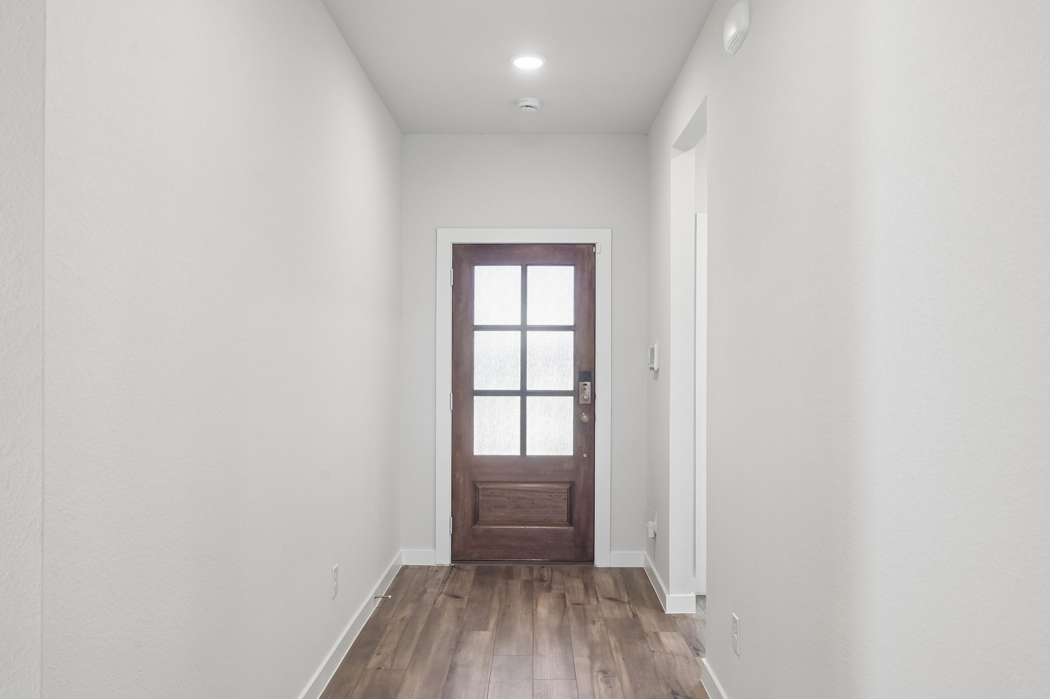 A room with a door and a window.