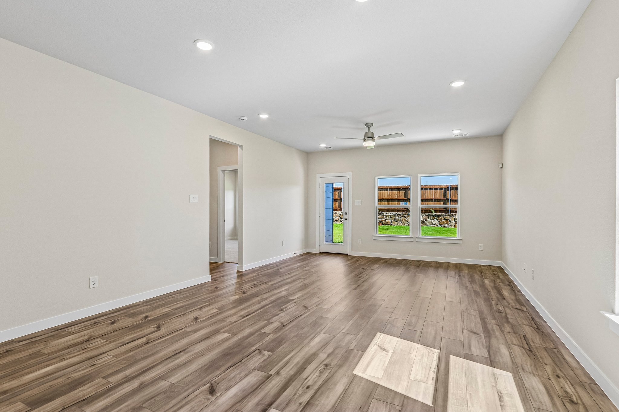 A room with a wood floor and a wood floor.