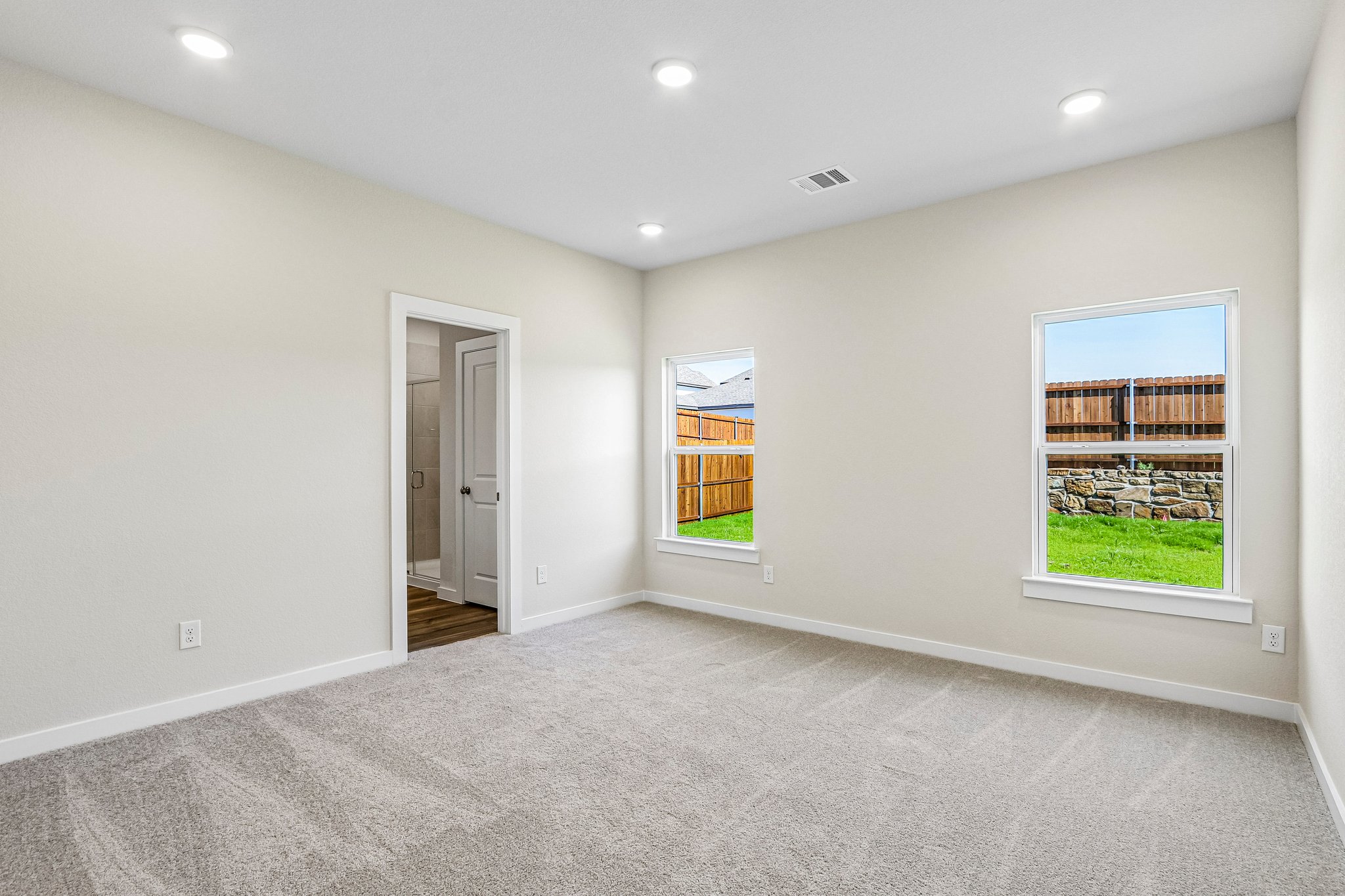 A room with a window and a door.