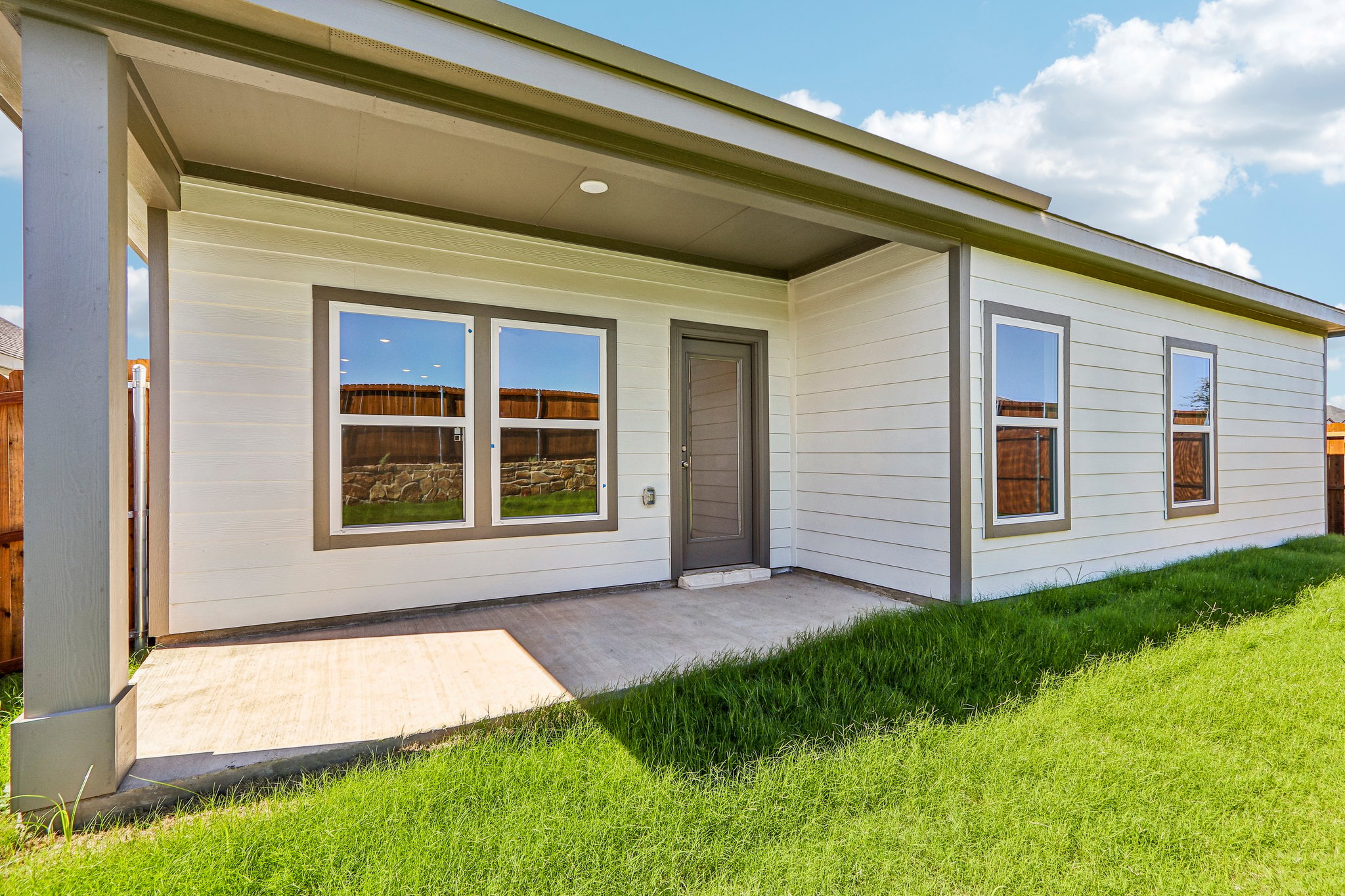 A house with a grass yard.