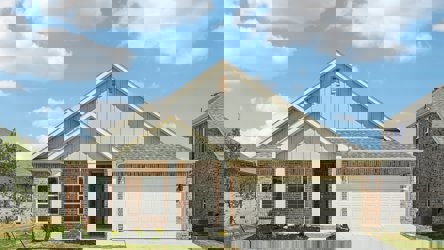 A house with a garage with American Gothic House in the background.