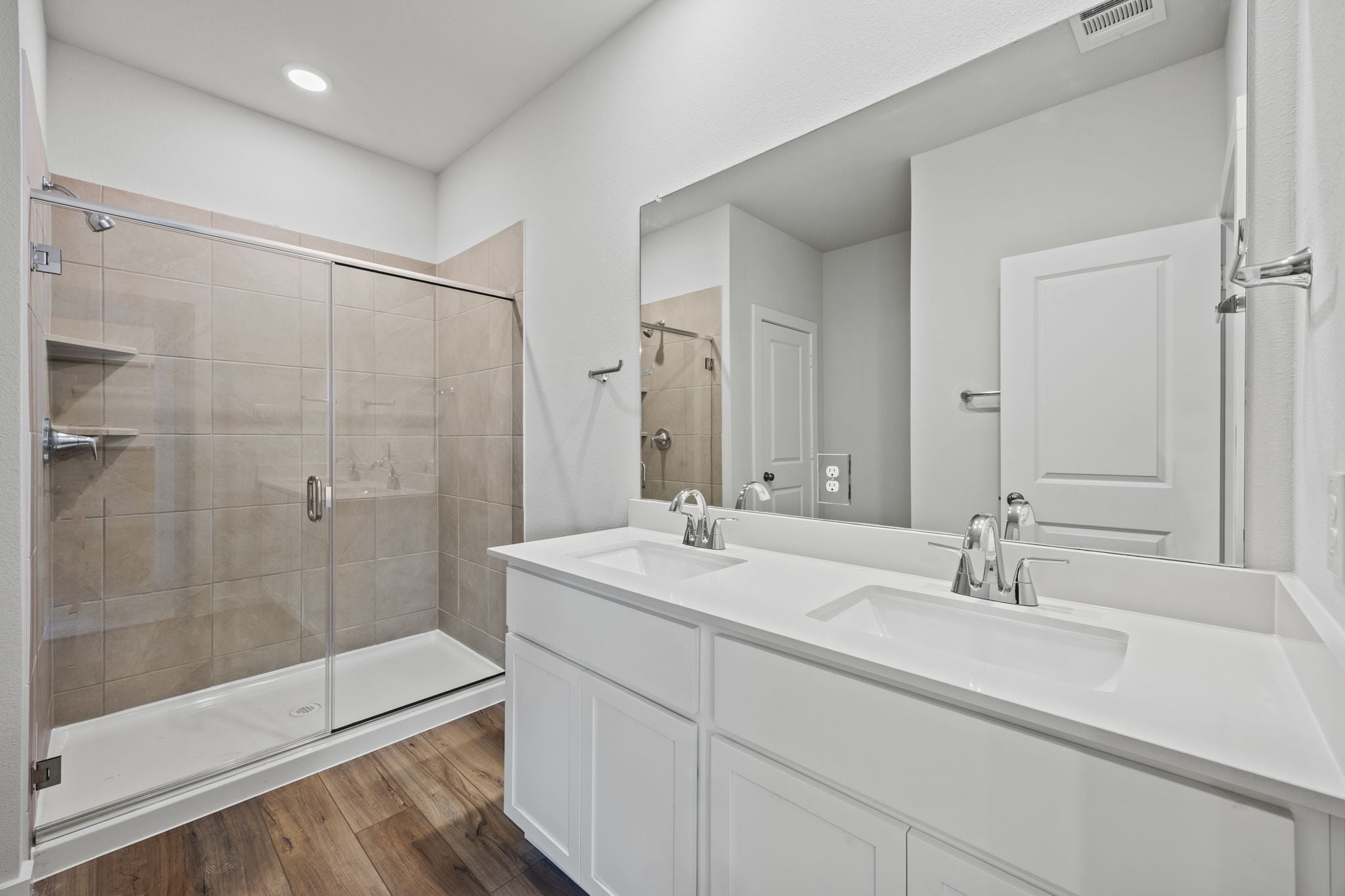 A bathroom with a glass shower.