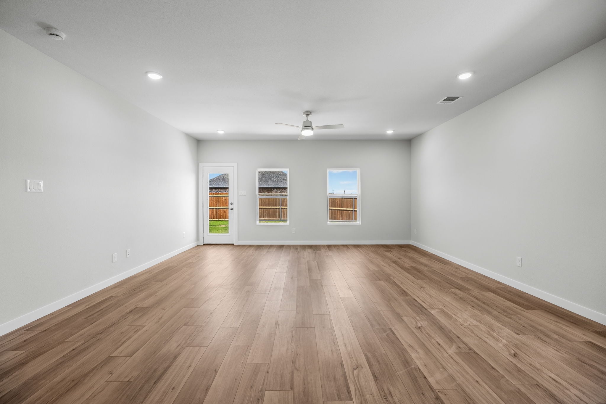 A room with a wood floor and a wood floor.