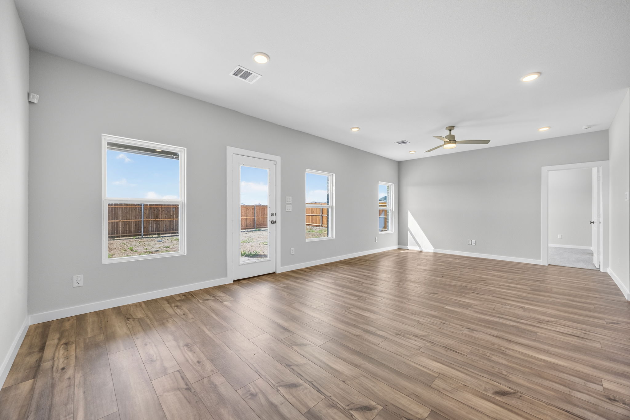 A room with a wood floor and a wood floor.