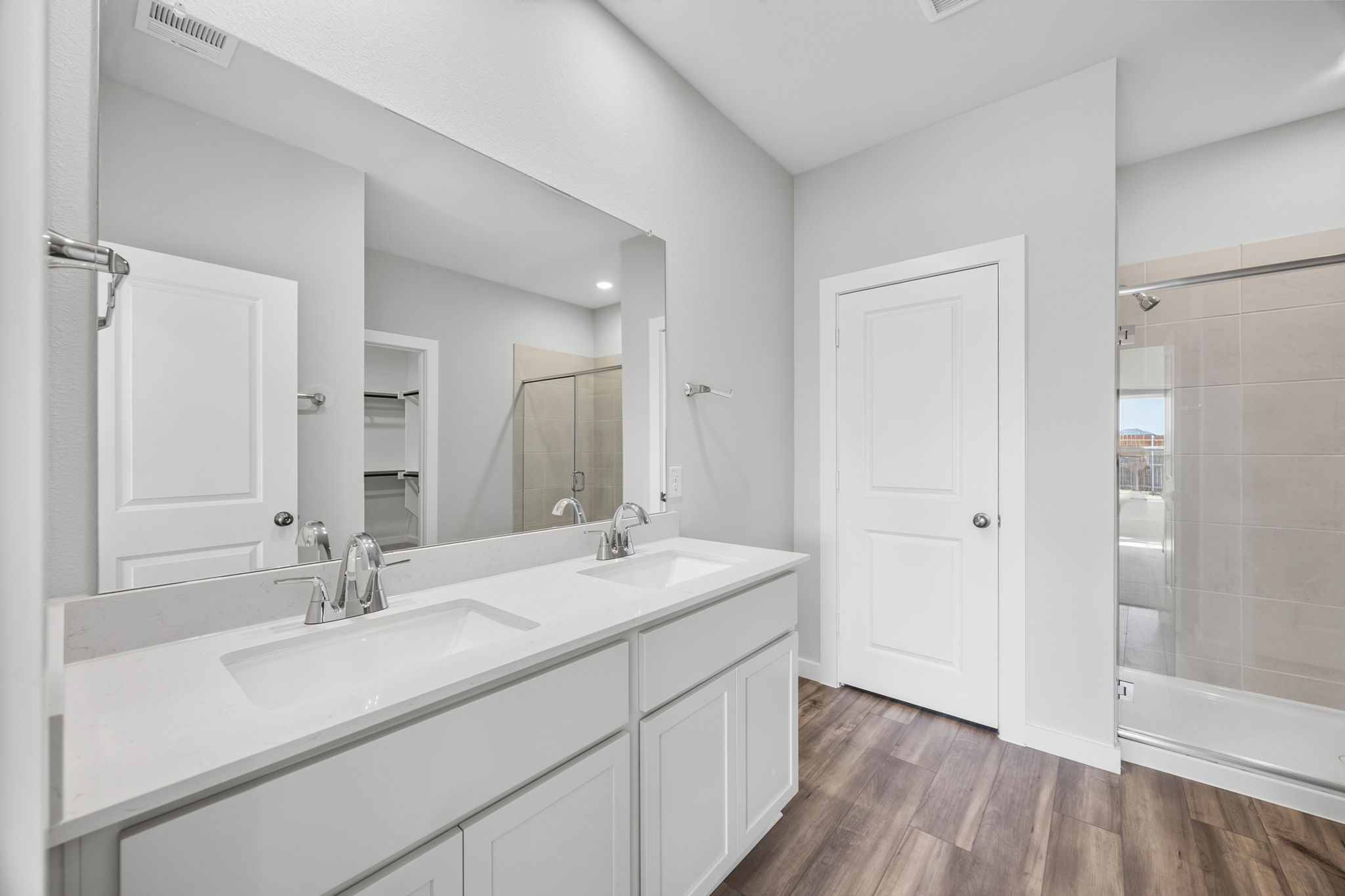A bathroom with a glass shower.