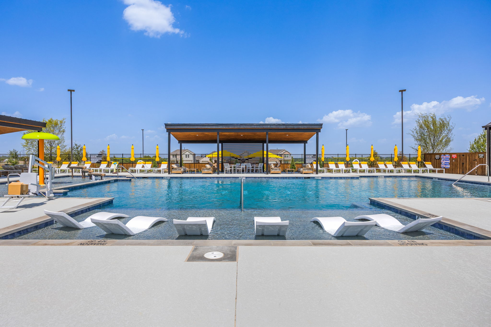 A swimming pool with a covered area.