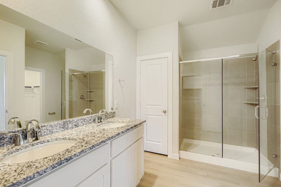 A bathroom with a glass shower.