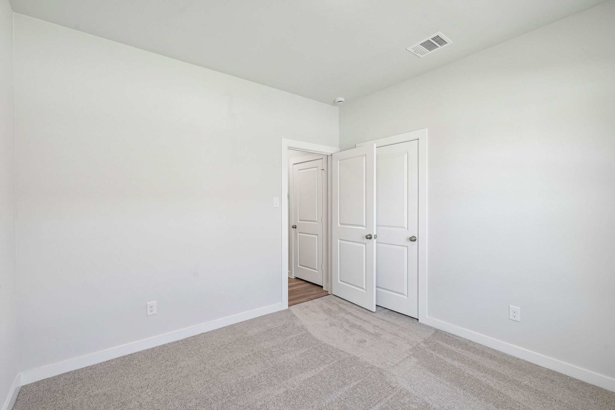 A room with white doors.