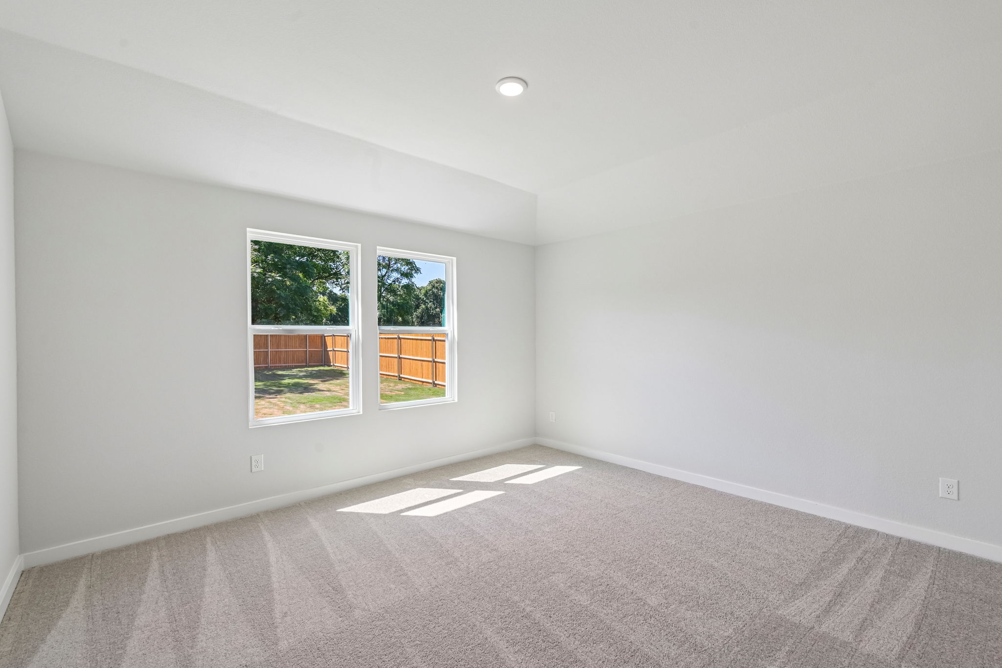 A room with a window and a door.