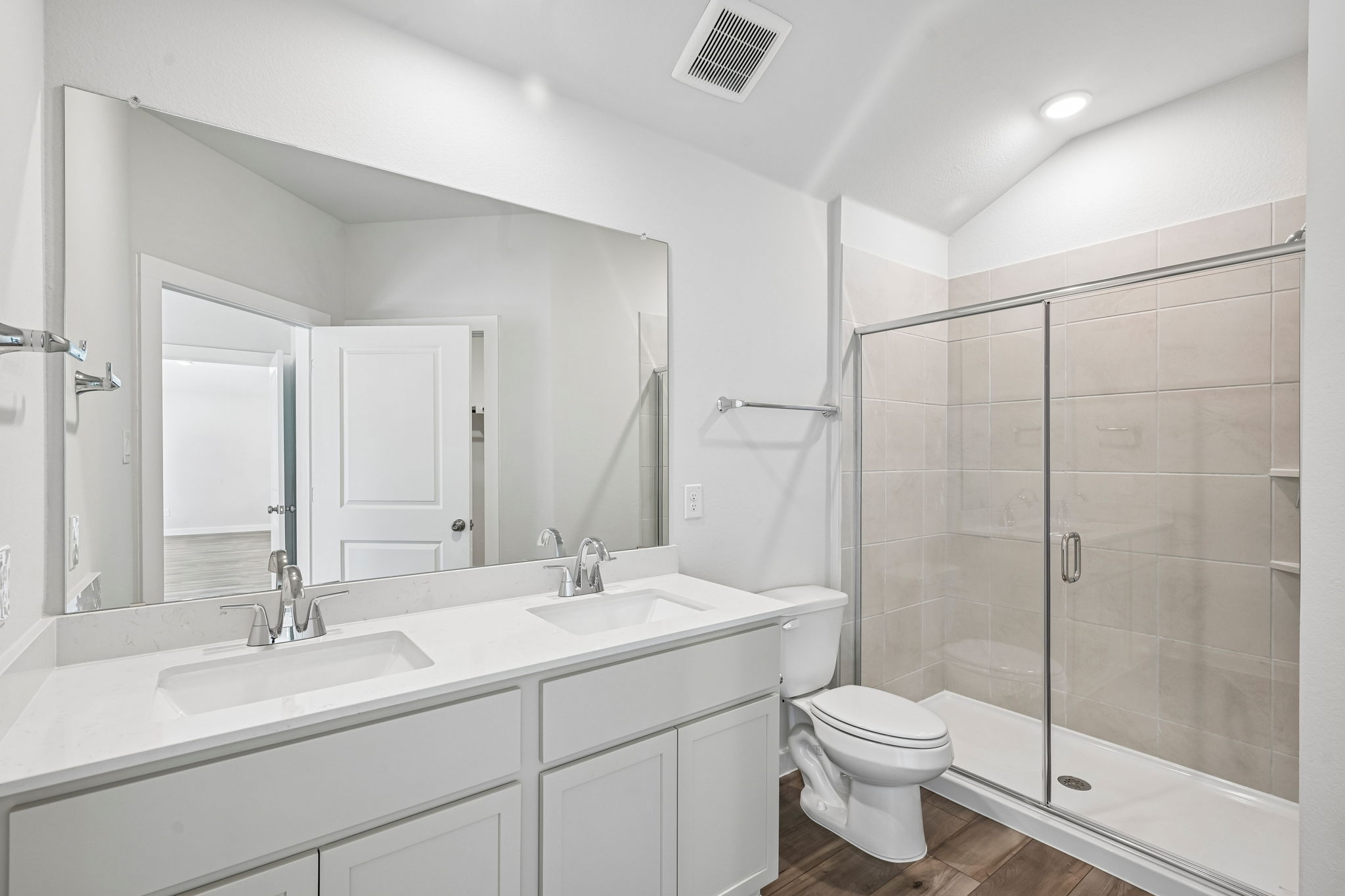 A bathroom with a glass shower.
