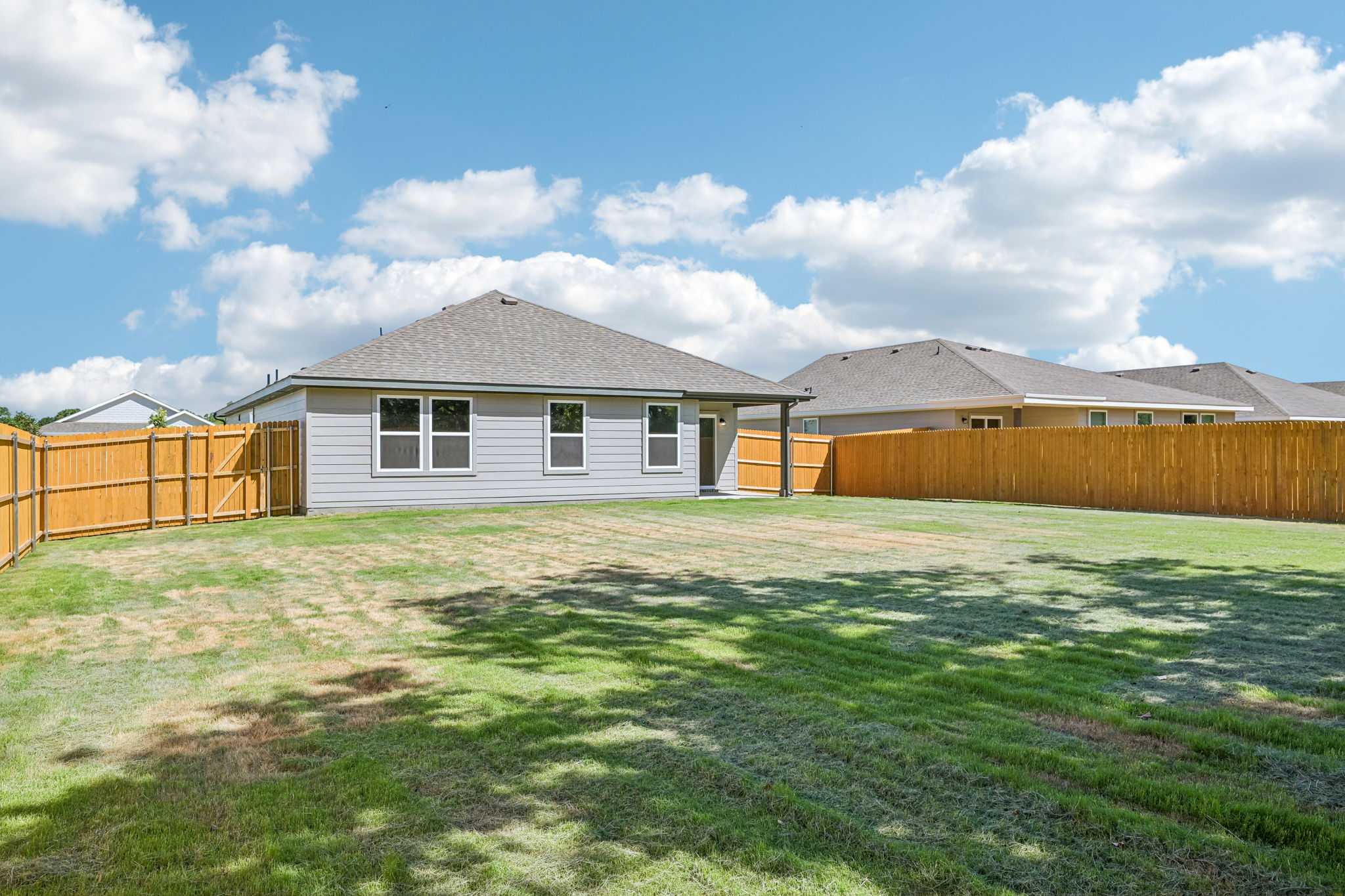 A house with a fence around it.