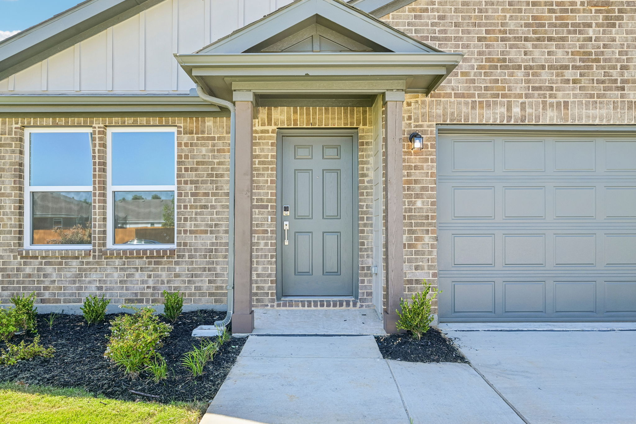 A house with garages and a door.