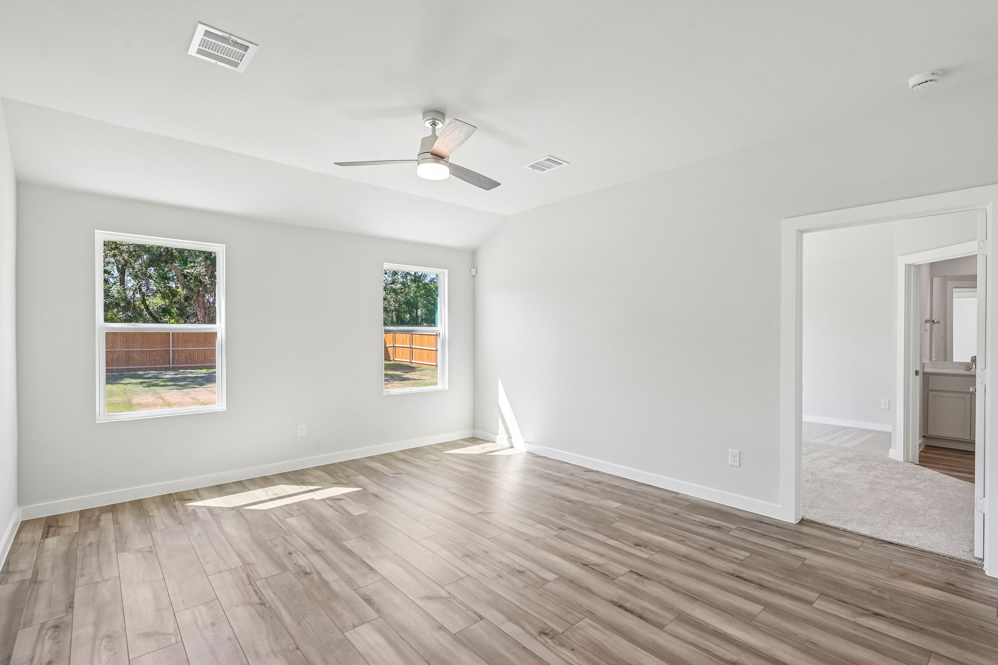 A room with a wood floor and a wood floor with a wood floor.