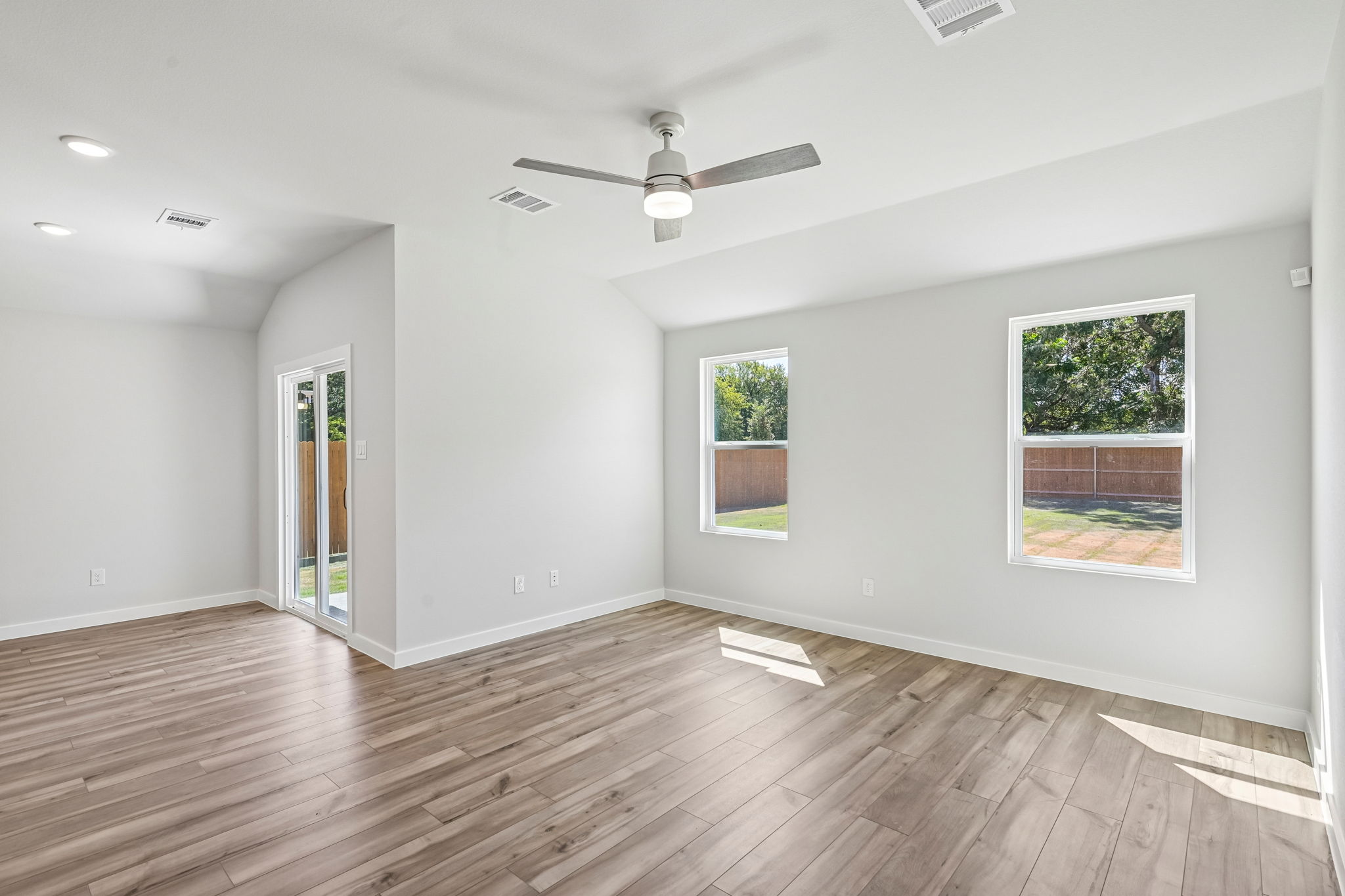 A room with a wood floor and a wood floor with a wood floor.