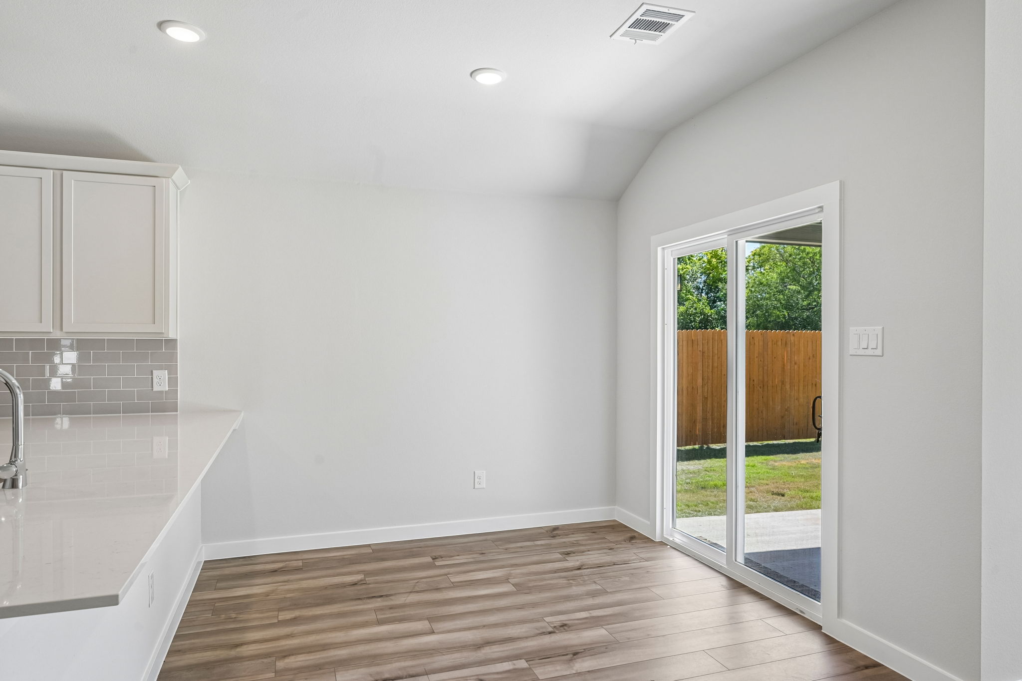 A bathroom with a wood floor.