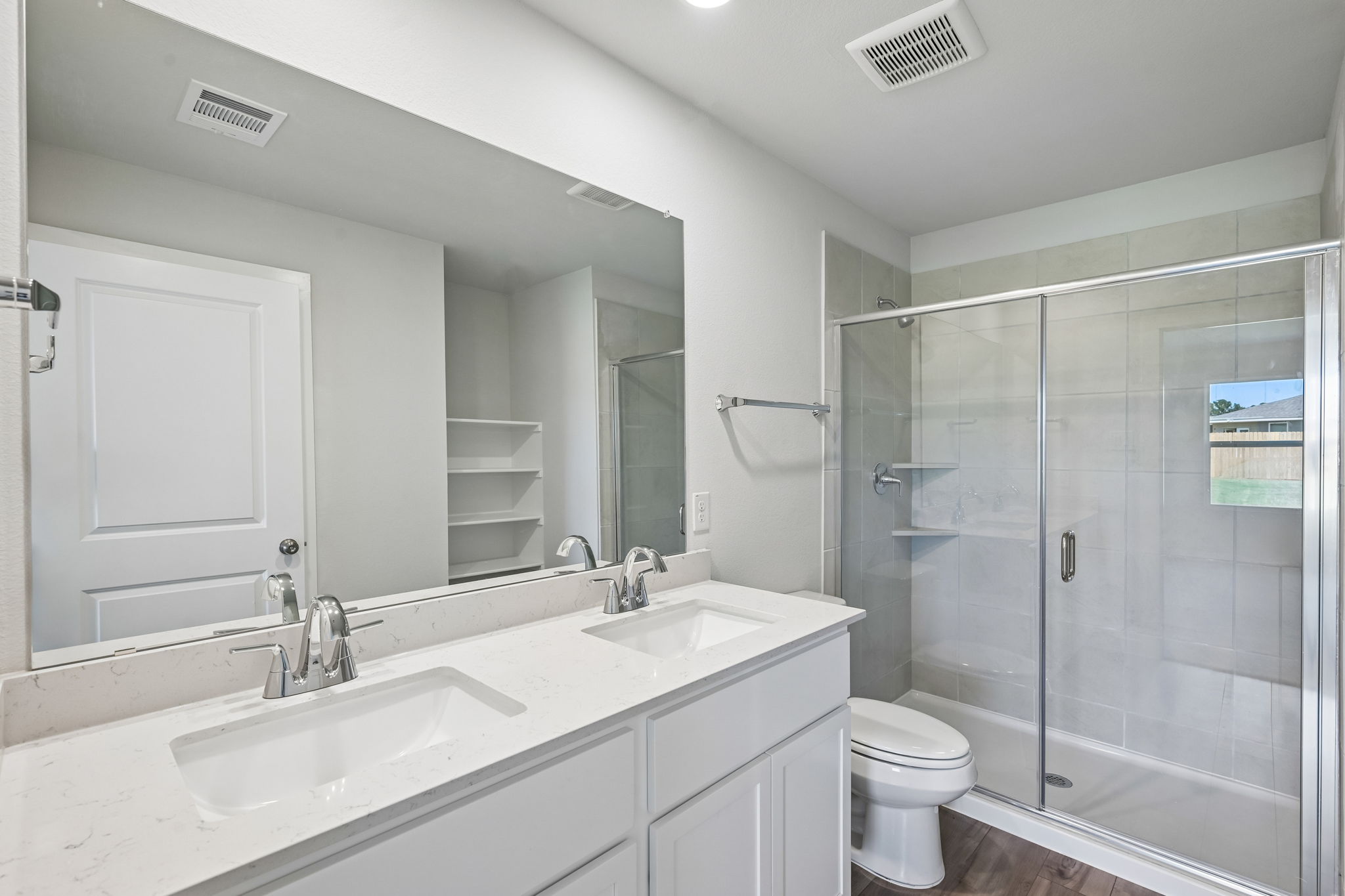 A bathroom with a glass shower.