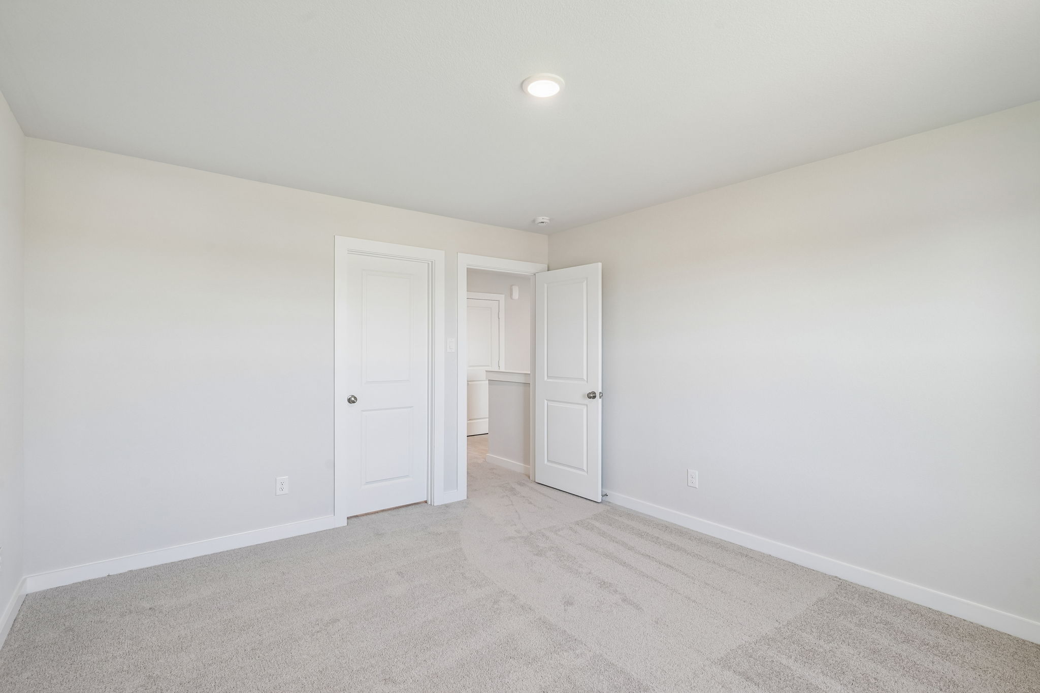A room with white doors.