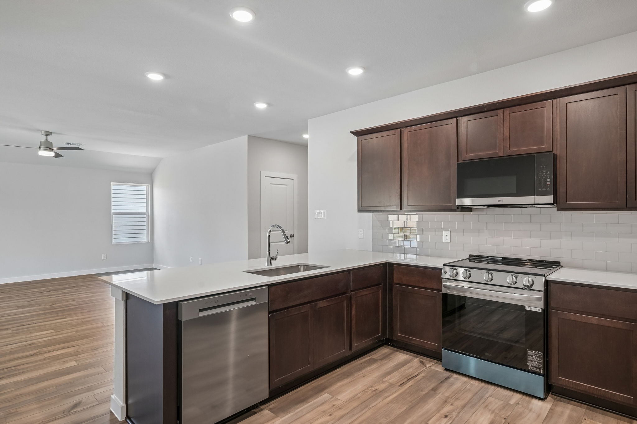 A kitchen with wooden cabinets.