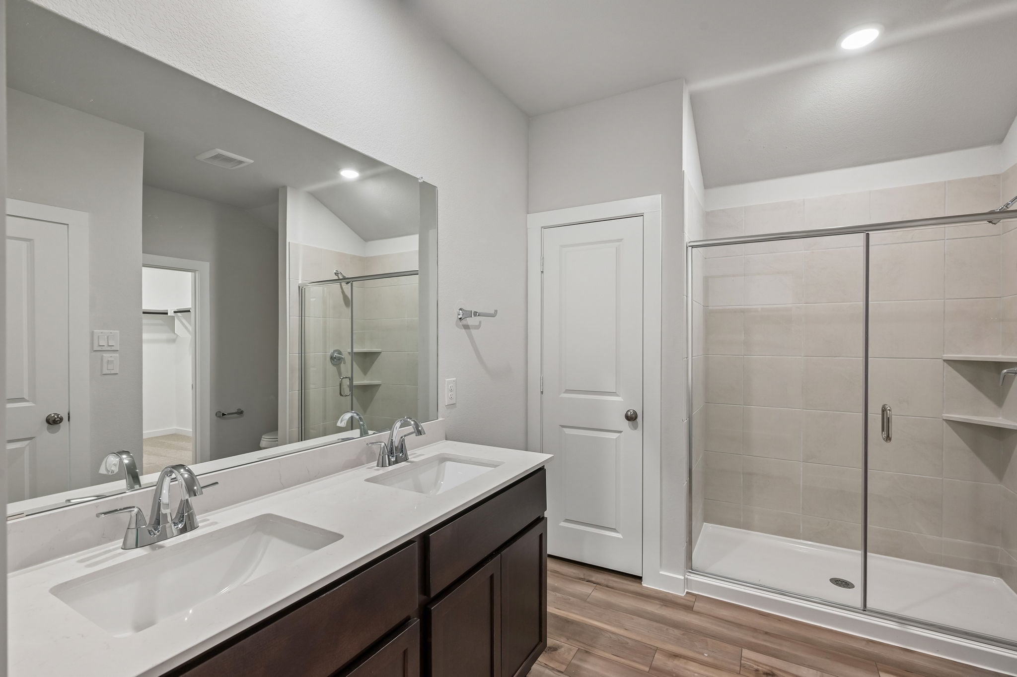 A bathroom with a glass shower.