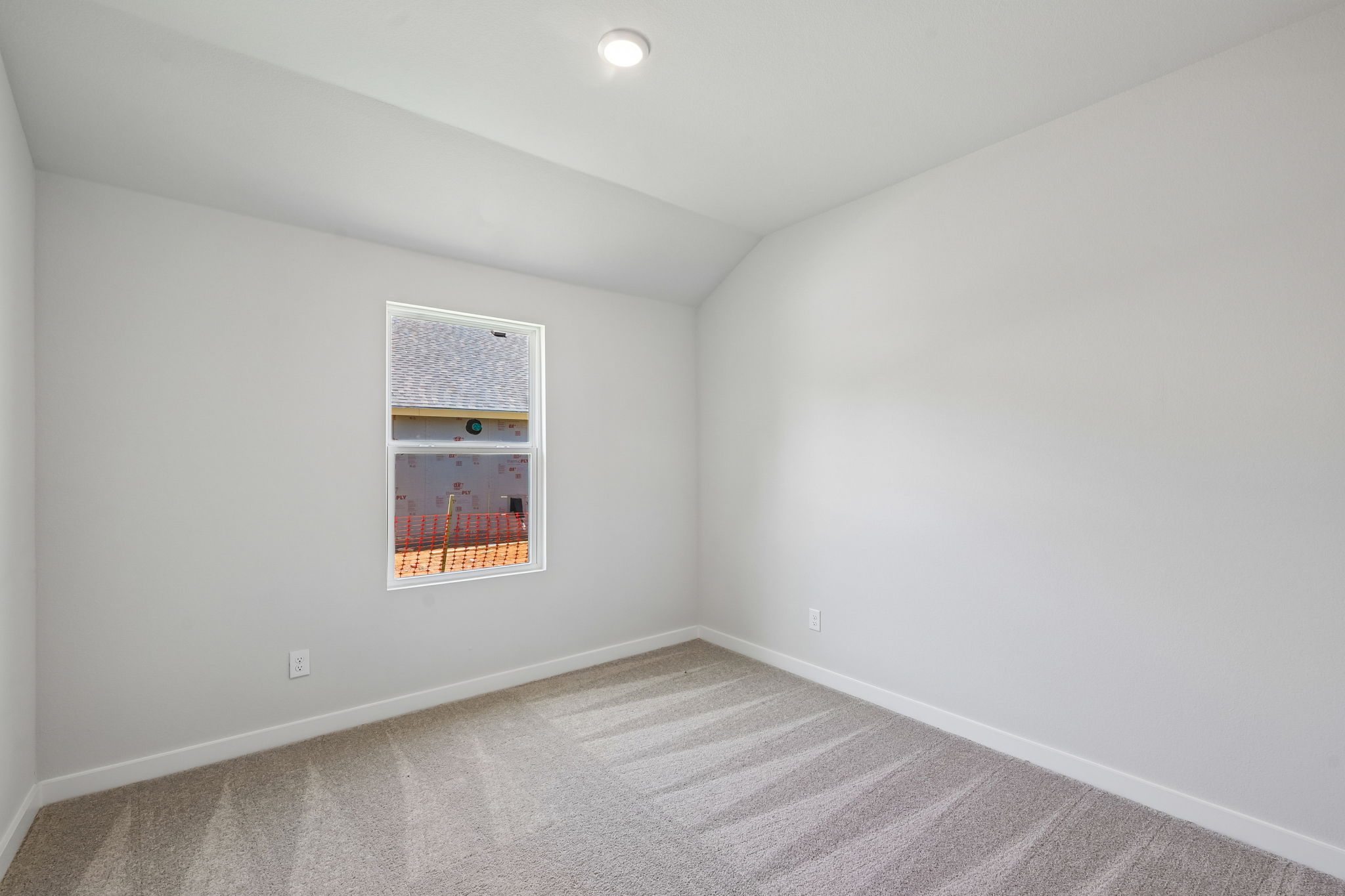 A room with a painting on the wall.