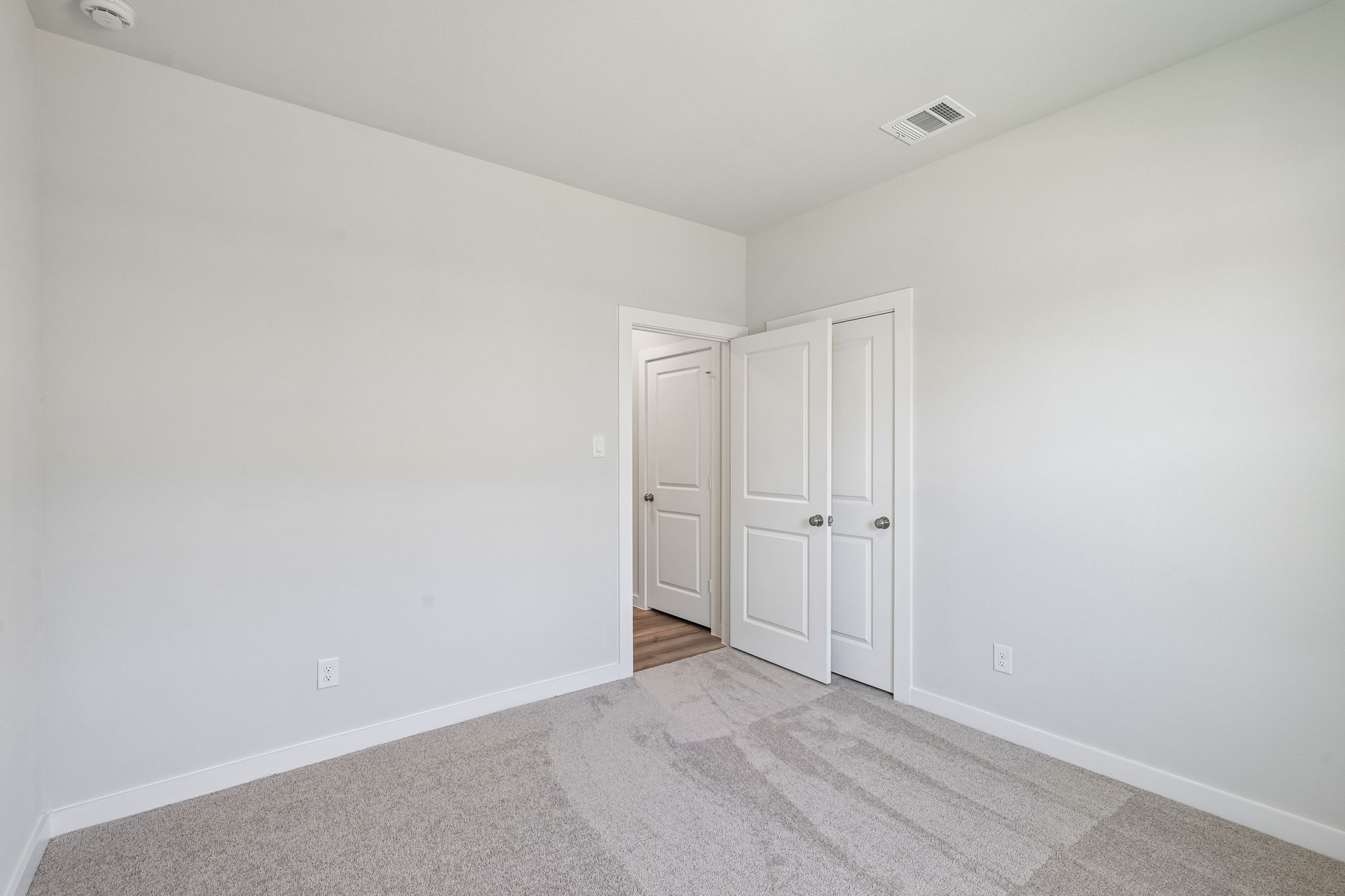 A room with white doors.