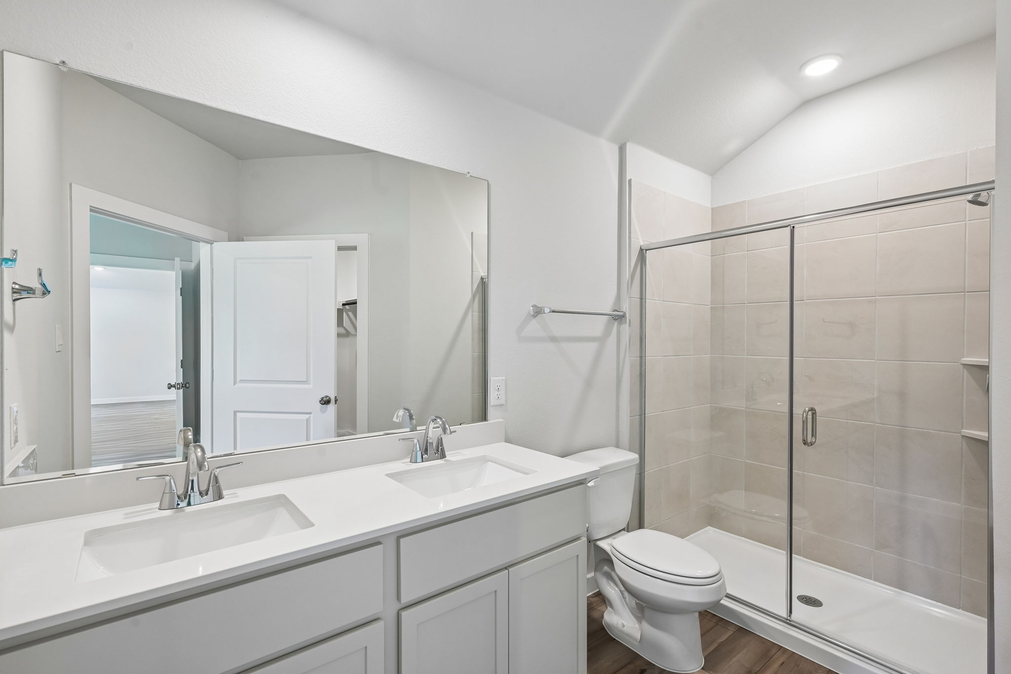 A bathroom with a glass shower.