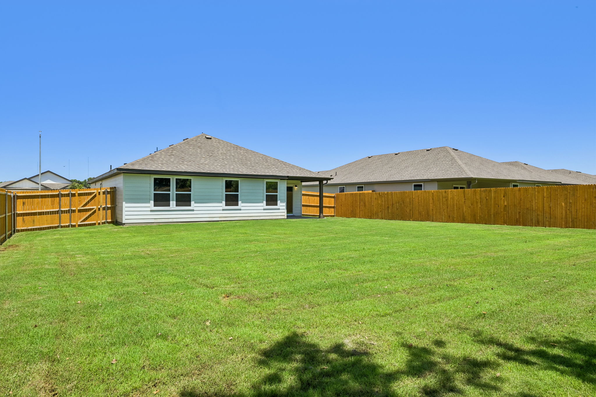 A house with a fence around it.