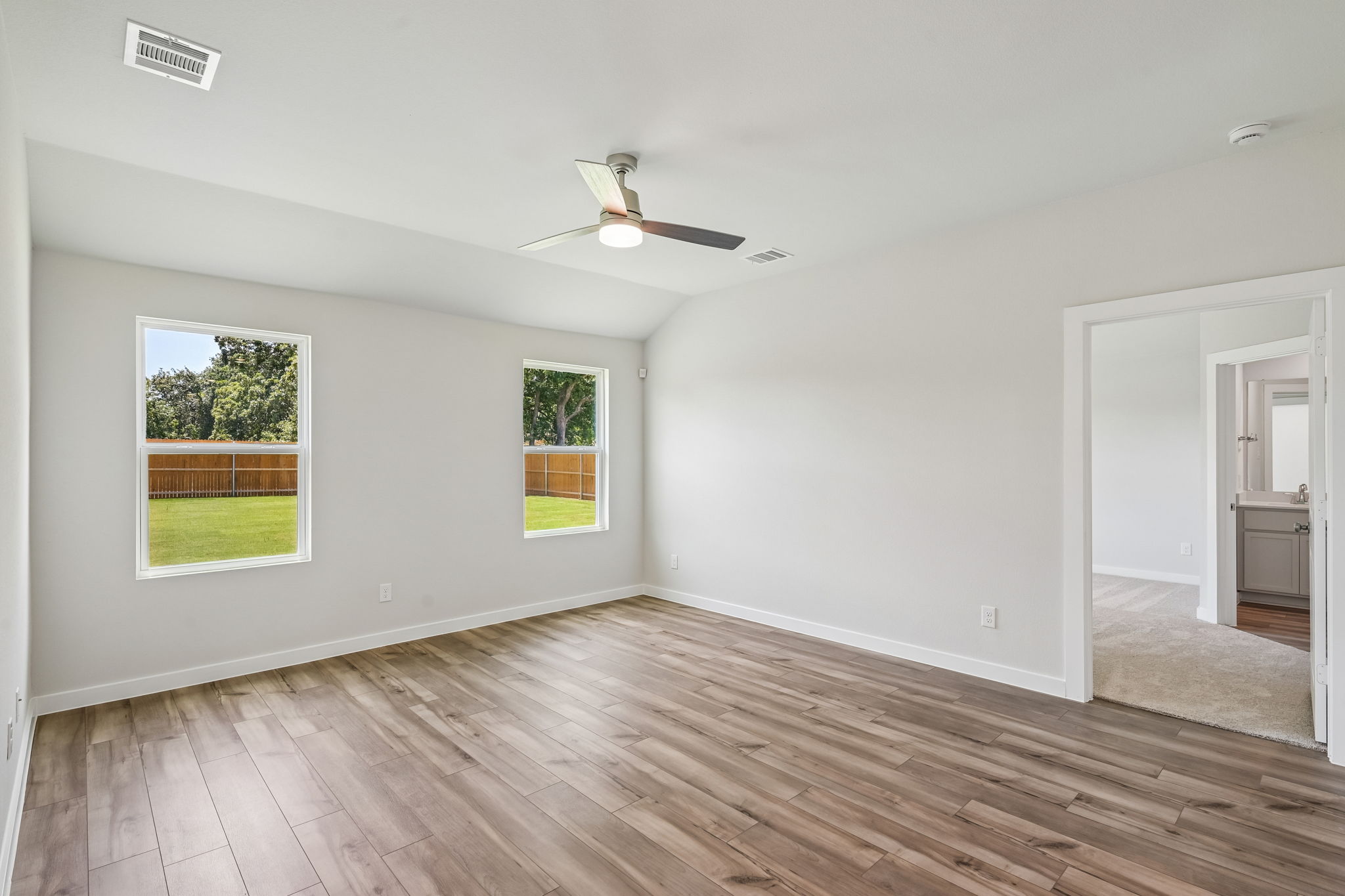 A room with a wood floor and a wood floor with a wood floor.