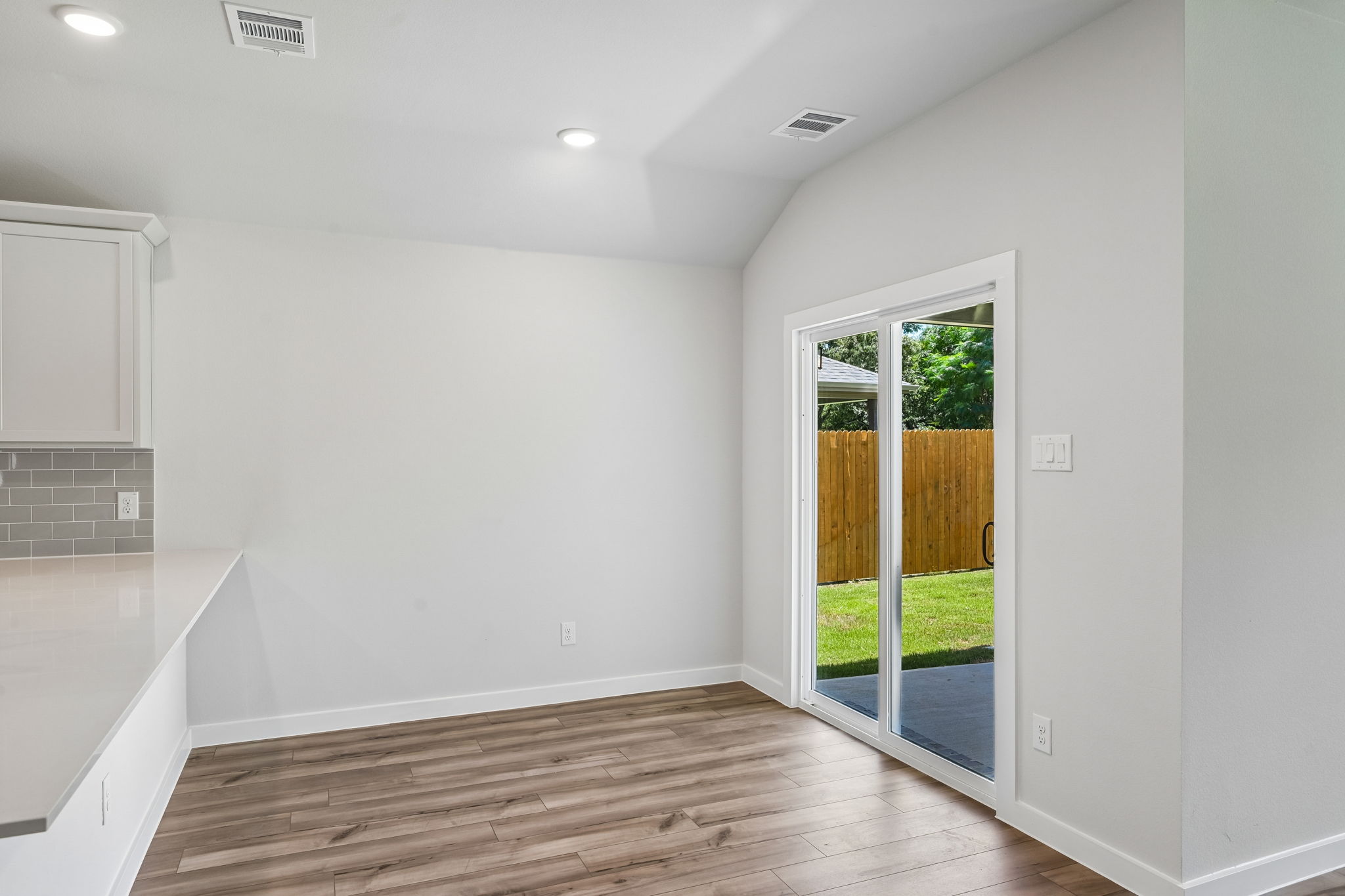 A room with a wood floor and a wood floor.