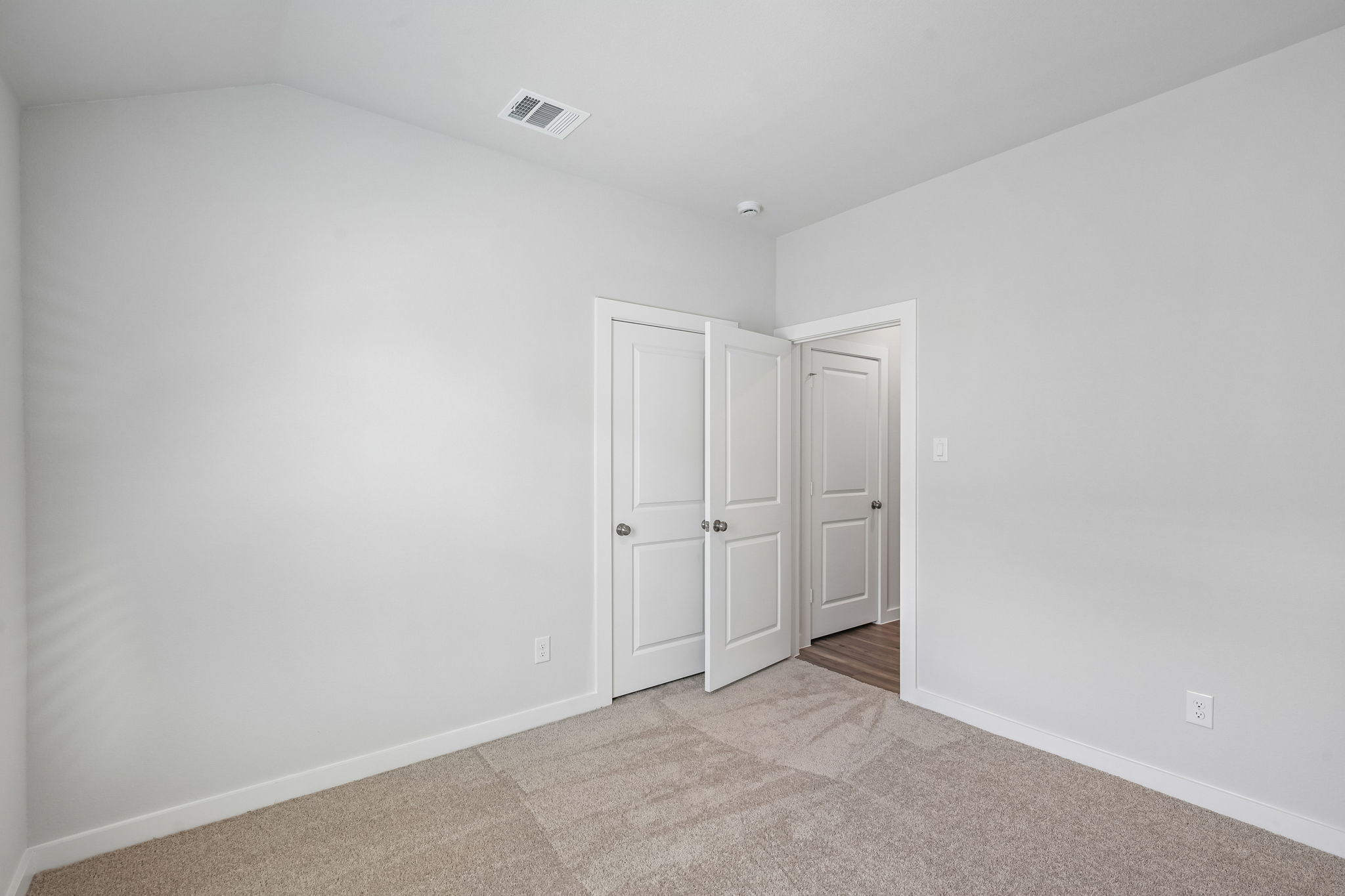 A room with white doors.