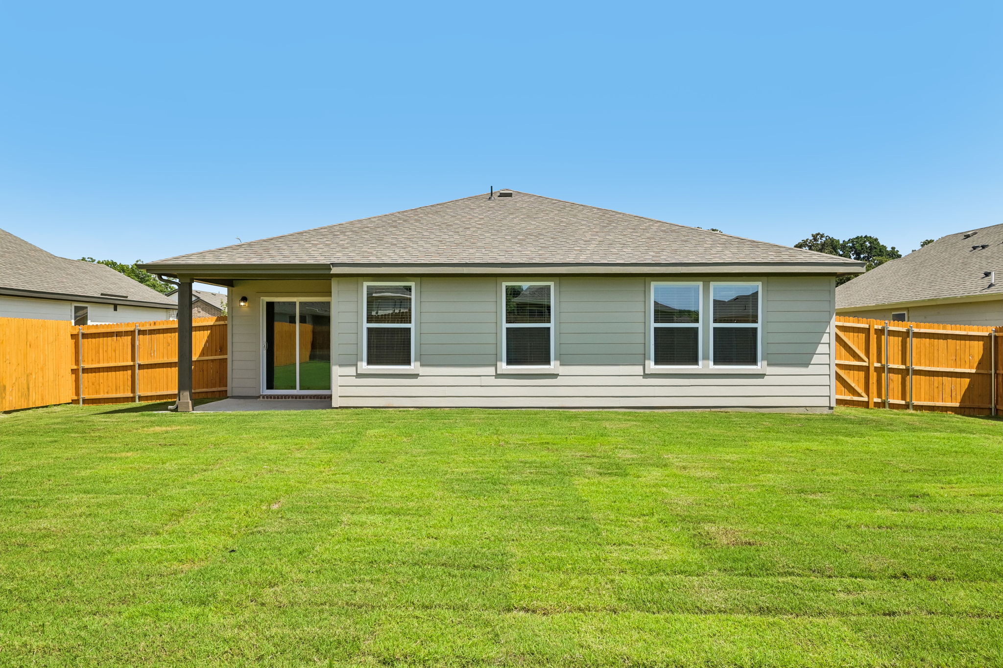 A house with a grass yard.