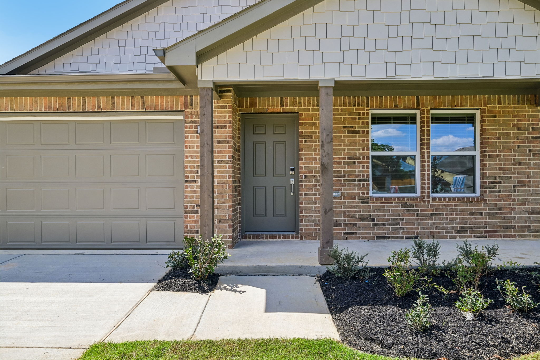 A building with a garage door.