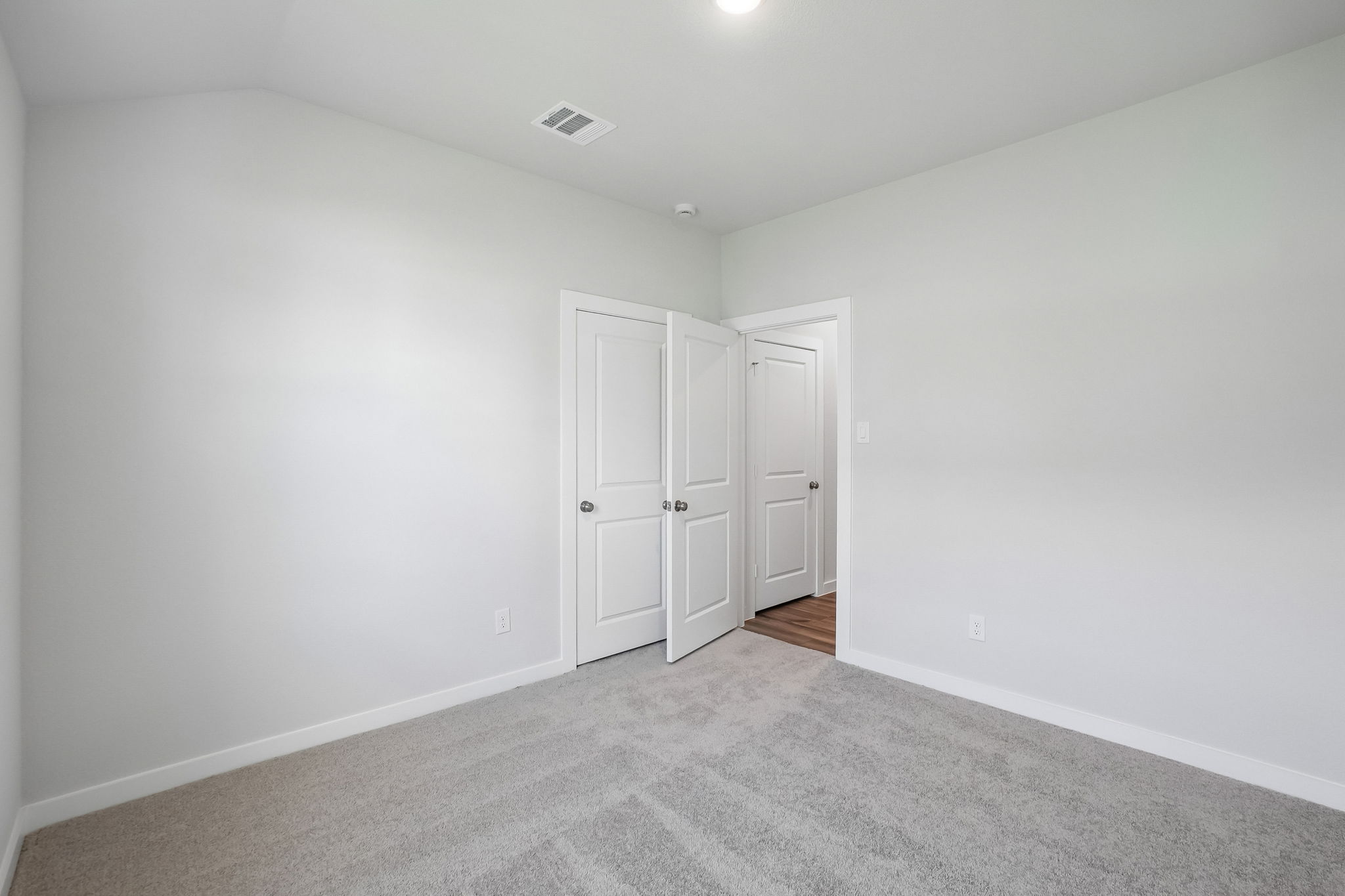 A room with white doors.