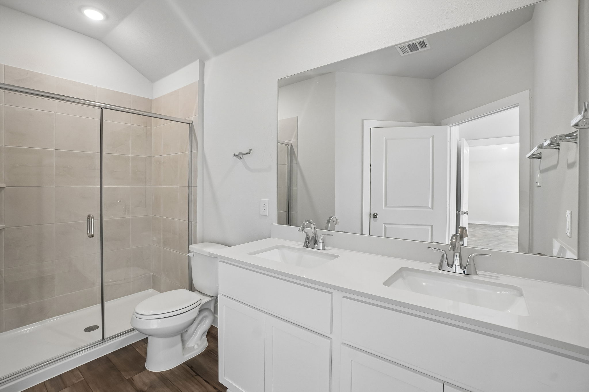 A bathroom with a glass shower.