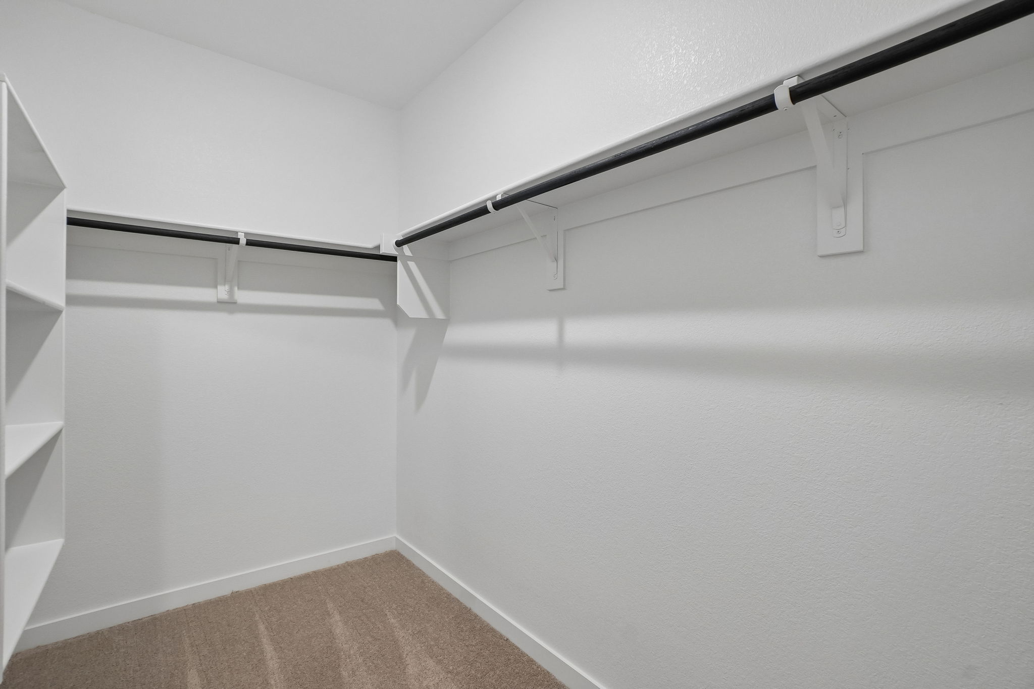 A white wall with a light on it.