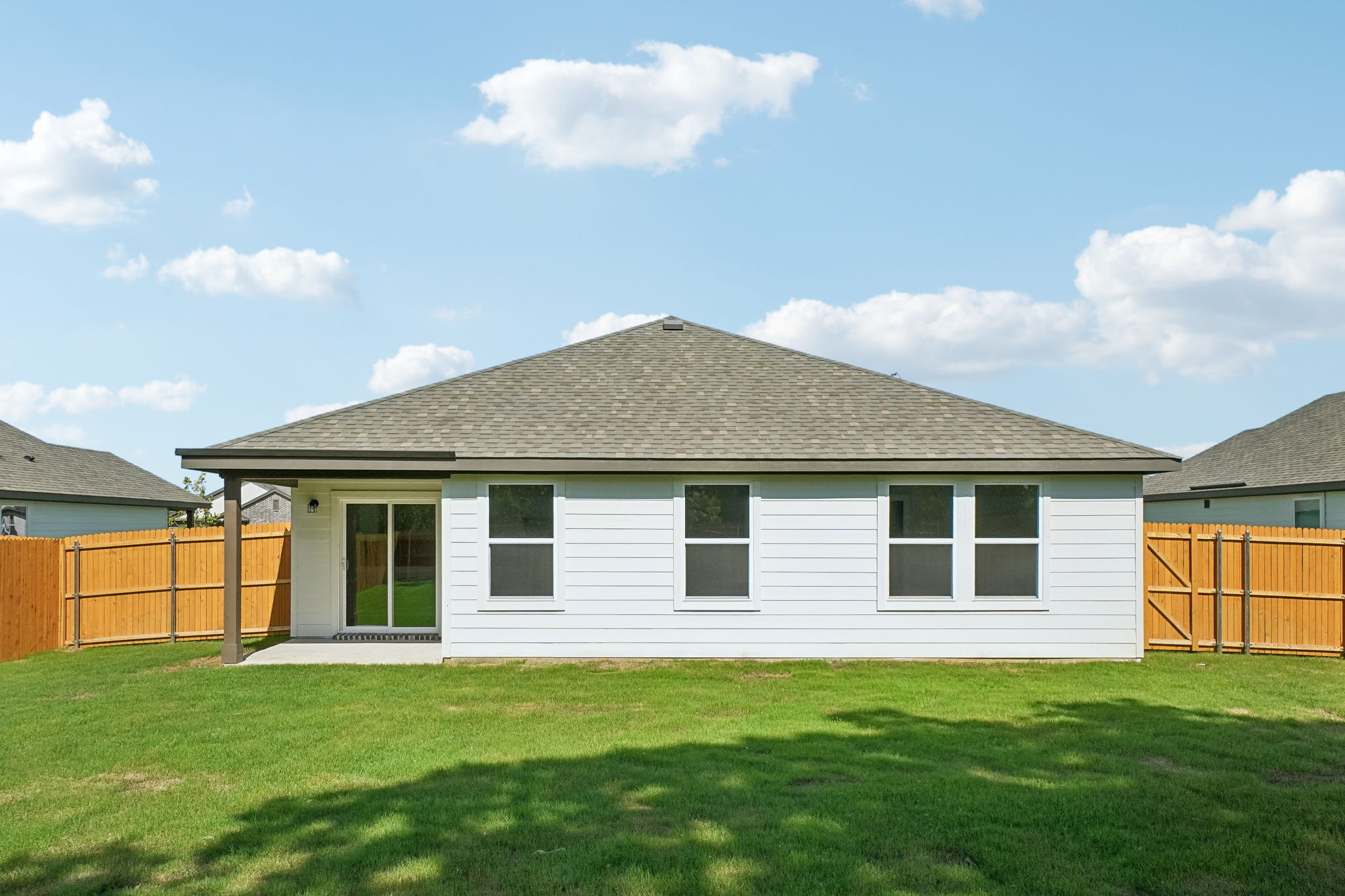 A house with a grass yard.
