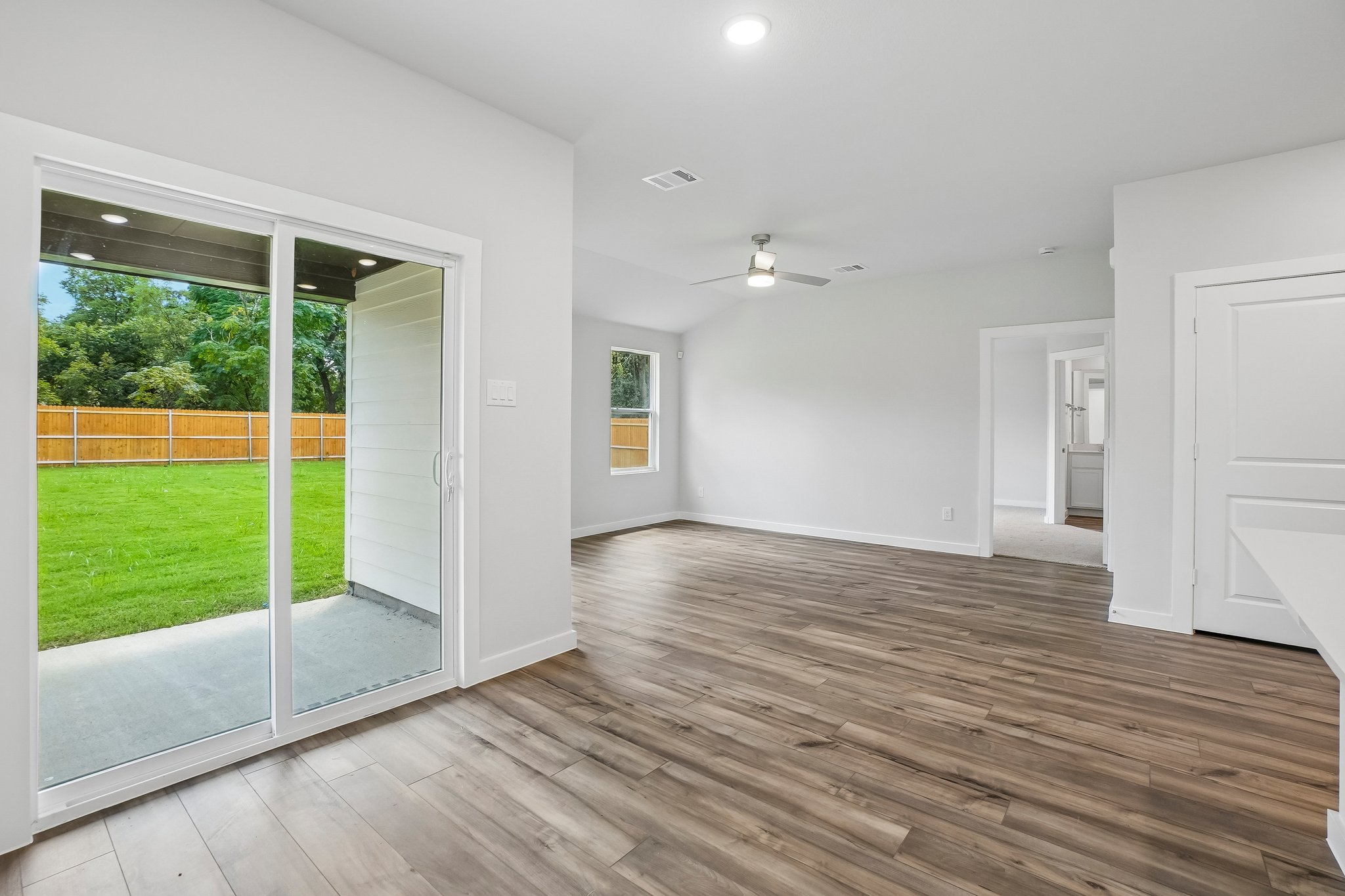 A room with a wood floor and a wood floor.