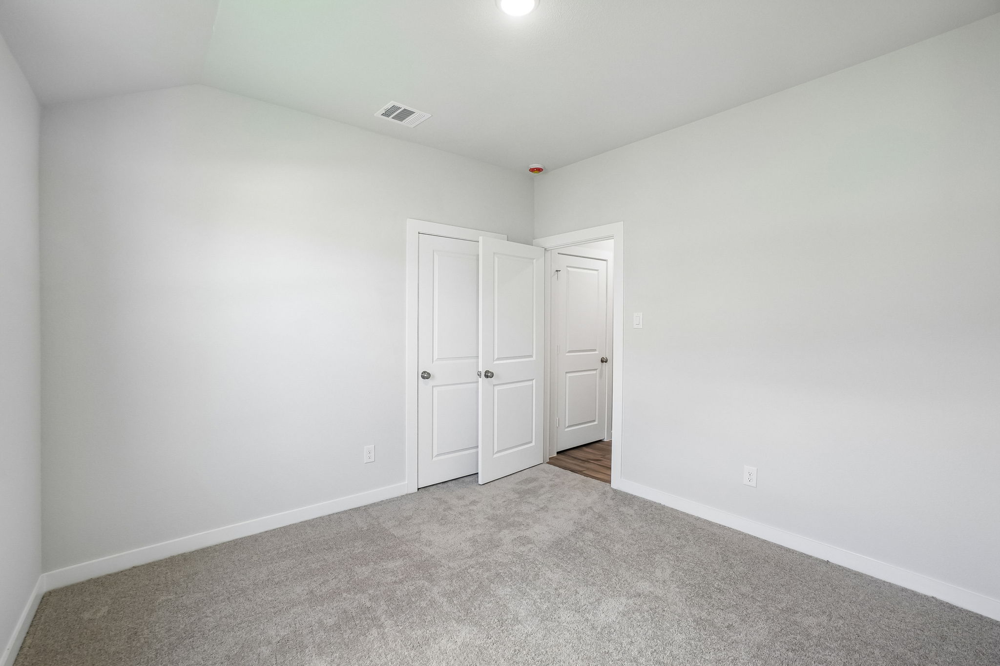 A room with white doors.