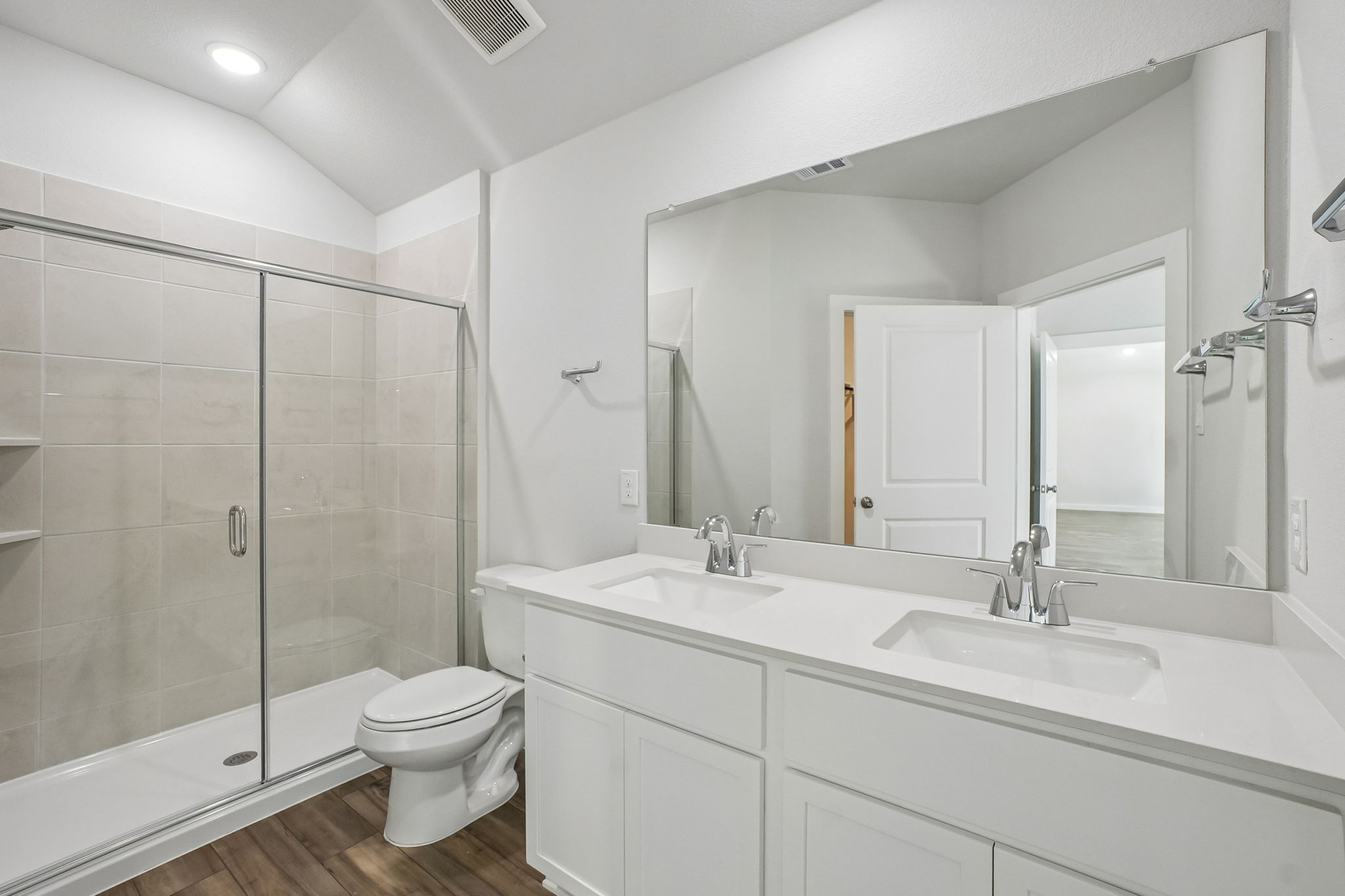 A bathroom with a glass shower.