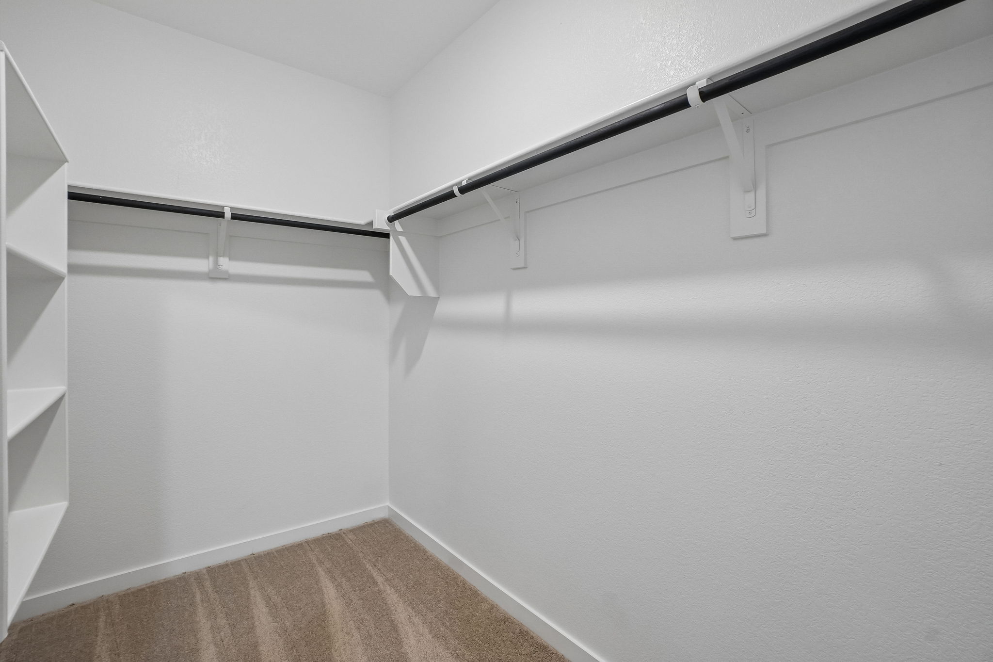A white wall with a white railing.