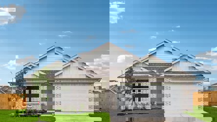 A house with a garage with American Gothic House in the background.