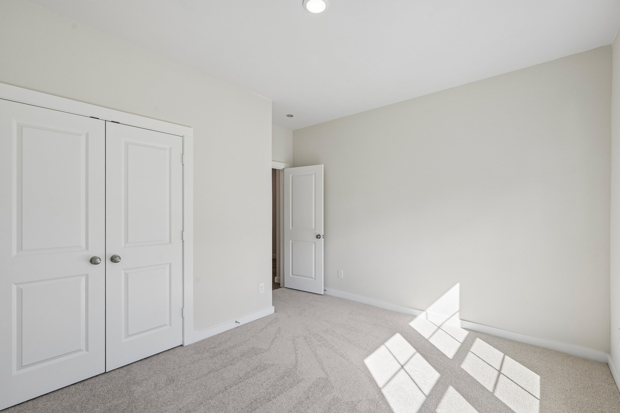 A room with white doors.