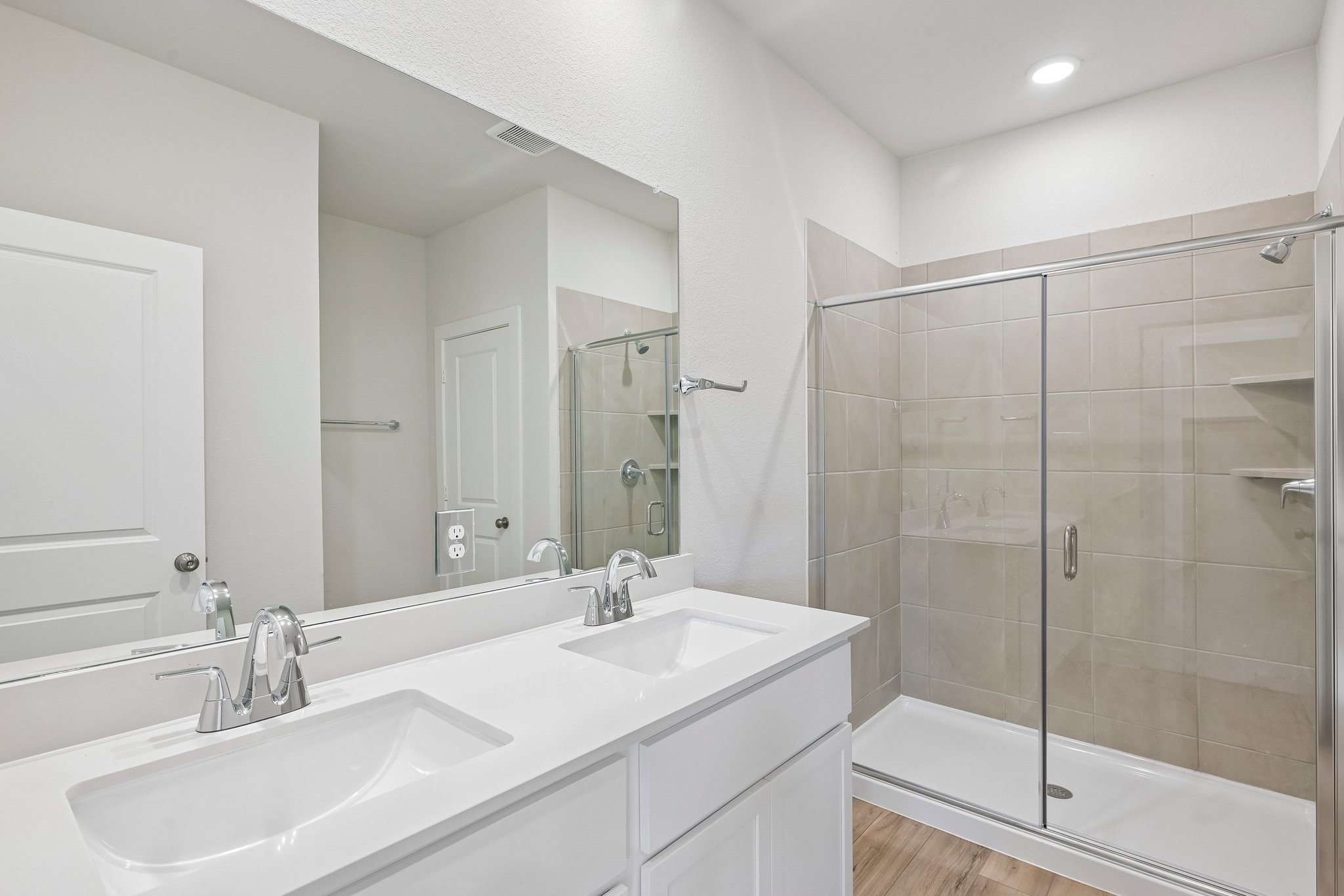 A bathroom with a glass shower.