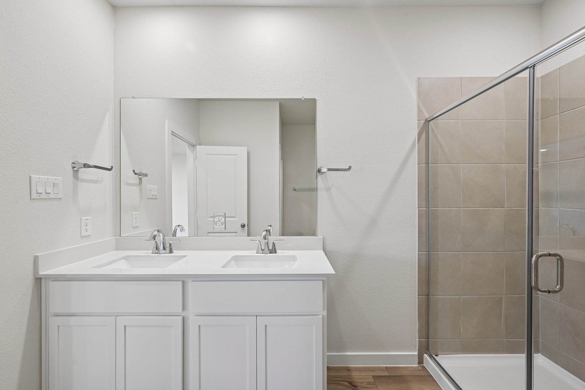 A bathroom with a glass shower.